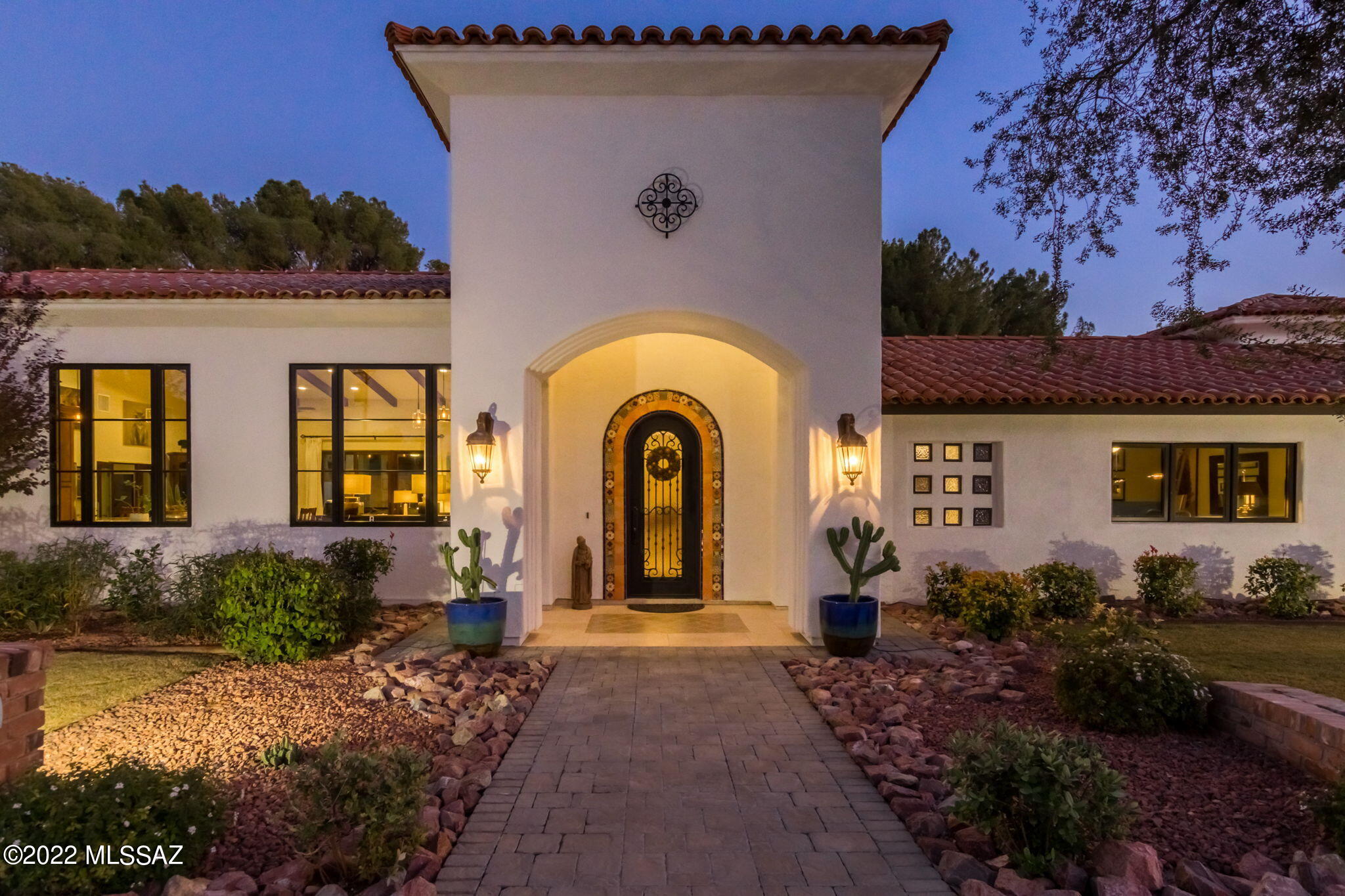 Rejoice in relaxation at the finest escape in Tucson County Club Estates. You will have it all in this completely rebuilt home finished in 2018. No detail has been spared, from the soaring ceilings to the cozy en-suite. Luxurious appointments abound making this the ultimate destination to recharge after a long day. Effortlessly entertain with a floor plan that can accommodate all your guests with ease and beauty. Take a dip in the newly remodeled pool complete with pebble tech and water feature or prepare a gourmet masterpiece in a kitchen designed for an executive chef. When it's time to turn in, it's all about you. Get cozy in the privacy of your own space including fireplace and courtyard. Meticulous finishes make this the perfect place to unwind. Peace of mind is ensured knowing that the HVAC and appliances are all less than 5 years old. When the best is a must, this is the estate for you.