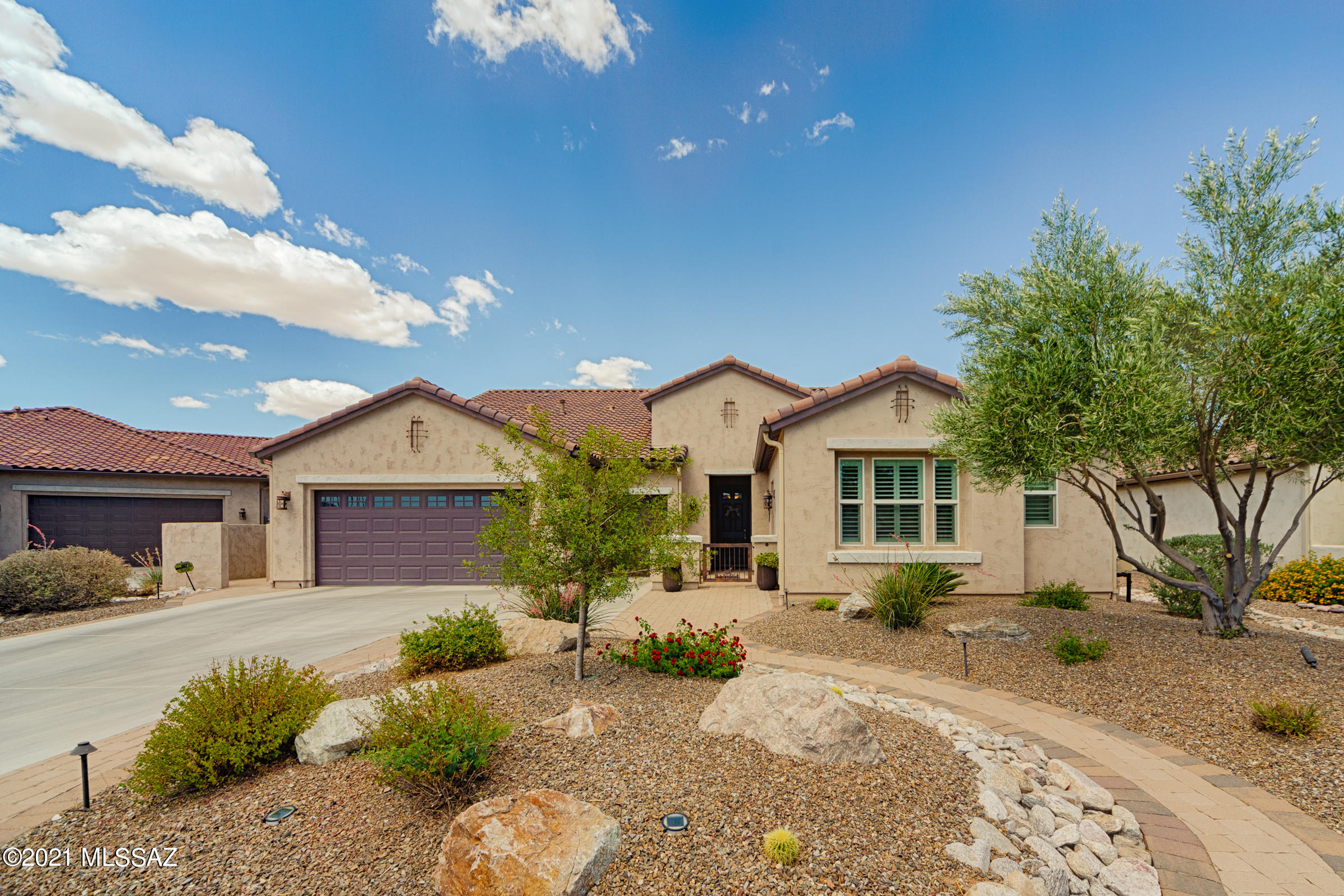 An incredible Pima Model Exterior Design A located on the most coveted street in SaddleBrooke Ranch.  You enter this beautiful home through a courtyard w/gate, porch, and then into a circular foyer – what an entrance!  The home includes a Master Suite/Bedroom w/the optional Bay Window, attached bathroom, and a large Walk-in-Closet; Powder Room; Den/Office; 2nd Bedroom w/attached bathroom; the Optional 279 sq. ft. Casita w/full bathroom and Walk-in-Closet; Laundry Room w/extra cabinets and a stainless steel sink; Kitchen w/Island that has a ''sit-up'' Counter, ''roll-out' cabinet drawers, and Walk-in-Pantry; Great Room that includes Dining Area; and a very large Covered Patio space w/built-in Fireplace and BBQ island w/natural gas.  Additional Great Room amenities include a Novus NXT dire vent gas fireplace that can actually heat the home; Crown Molding (that is also in the Den and Master Bedroom); and a Premium Home/Entertainment theatre system. The flooring is a "wood-look" Sonoran tile throughout the home except for the bedrooms which are a Short Mohawk Portico carpet. Amenities in the Kitchen include White Thermofoil cabinets w/Baroque glass; "White Ice" Granite Counter tops; Blanco Sink, and highly upgraded Monogram Stainless Steel appliances. This home has a full SST security system but does not include the Casitas. Contemporary Hunter Douglas shutters are installed in the Office/Den, Bedroom #2, Dining room, and the Casitas. Ceiling fans are installed in all rooms including the Outdoor Patio. The garage (2-Car + Golf Cart) has the optional 4' Extension and is epoxied + has 9 double-door cabinets that transfer with sale.  The refrigerator, washer, dryer, and window coverings are included with the sale as well. There is also a state-of-the-art Pelican Water Filtration system installed next to the Water heater.  The owners just recently added a powder coated all-aluminum Patio Cover of ~500 sq. ft.+ they have installed Tucson Rolling Shades. Both front and back yards have lighting, irrigation, back yard is fully fenced, and there are rain gutters on the house. Please note  owners have an on-going maintenance agreement with the Home Team/Orkin Pest Defense i.e., both a Termite Baiting Service and a Taexx Pest Control Service. With all these amenities on this beautiful home and then the most incredible sunset views off the back patio this is a truly unique home.
