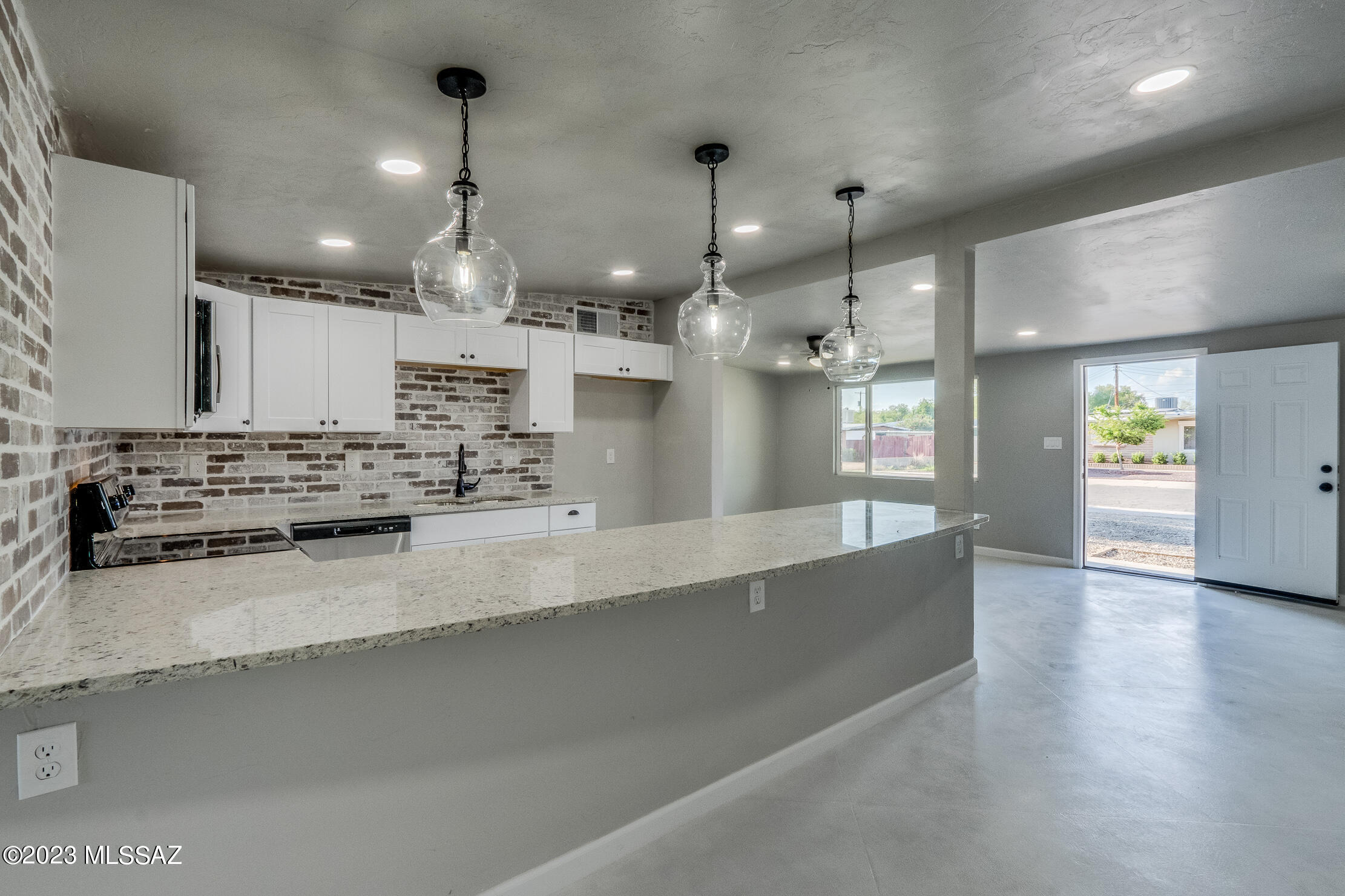 Range priced $310,000- $320,000. Absolutely gorgeous remodeled home in west central Tucson. This home shouts perfection from the moment you walk in the door. Be greeted by custom concrete floors that lead to an amazing new gourmet kitchen with granite counter tops. Stunning brick backsplash and all new lighting. New windows, HVAC and water heater. You will love the spa like bathrooms with custom surrounds and all new vanities and fixtures. Large backyard with block wall and just minutes from I-10. Seller is licensed to sell real estate in Arizona.