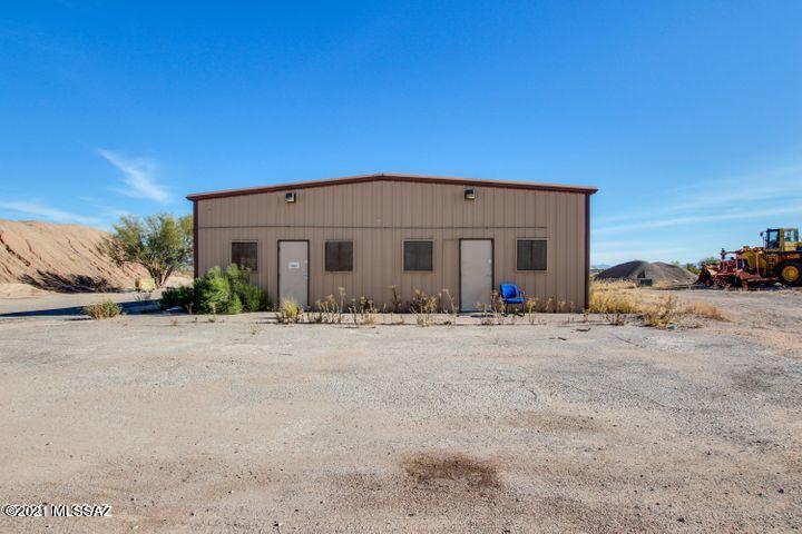 COMMERICAL LAND WITH BUILDING ZONED FOR INDUSTRIAL. THIS PROPERTY ALSO CAN BE USED AS A GUN RANGE. THIS PROPERTY ALSO HAS A 4000SF METAL BUILDING (OFFICE SPACE)- 40' X 100'. ONSITE 6'' WELL. 480V 3P 2000+ AMPS ON SITE - UNDERGROUND. 12.64 AC OF CI-2 INDUSTRIAL PROPERTY OF TUCSON EAST SIDE (EAST OF KOLB ON VALENCIA). EXCELLENT FOR A SMALL TO MEDIUM INDUSTRIAL USER.