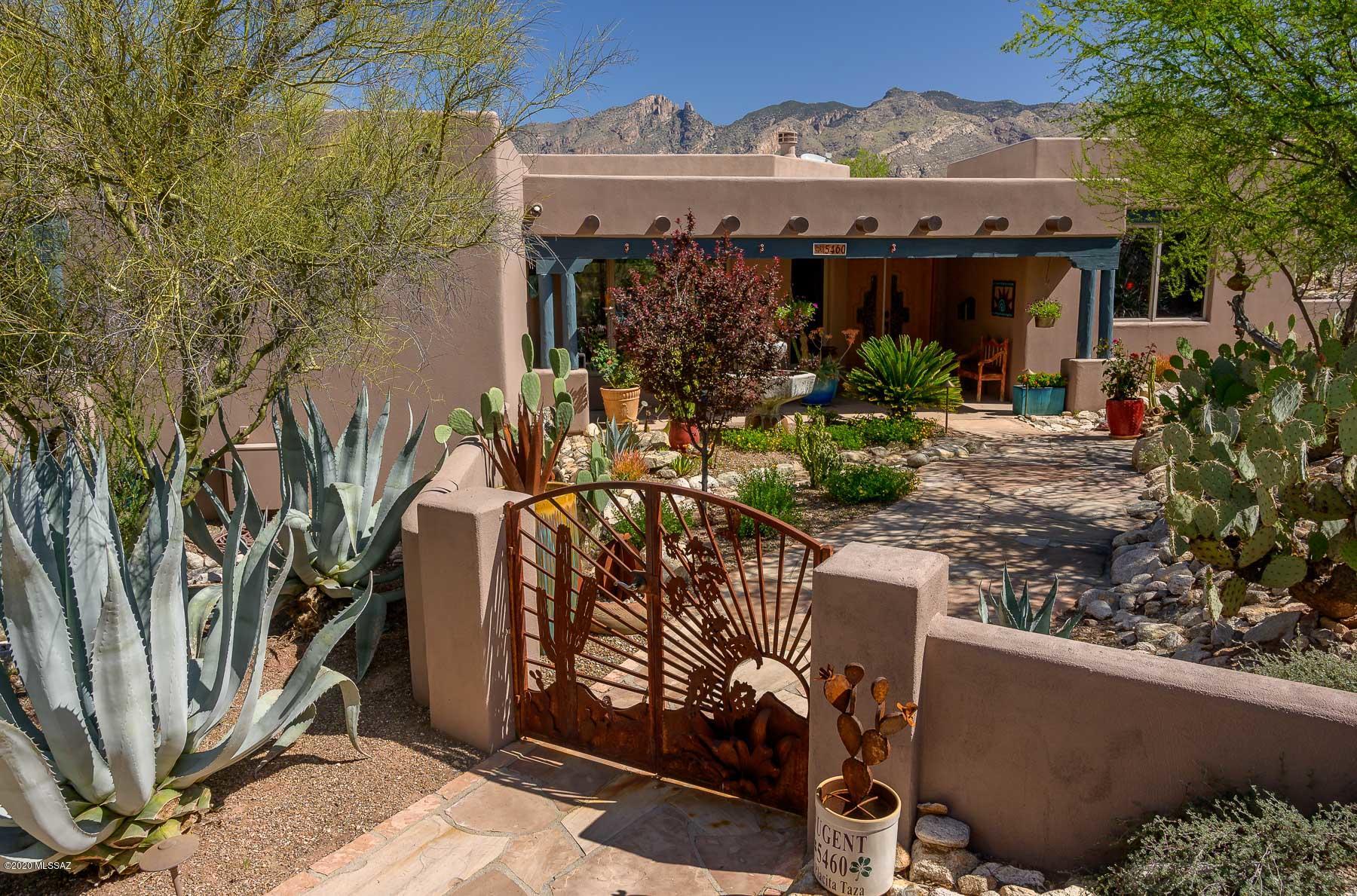 This unique, one of a kind home is located in the secluded 5-star resort like area of the Catalina Foothills Estates #10. Custom-built, solid masonry construction with a long private drive that leads into the vibrant and inviting Santé Fe designed home. Hand Crafted gates open into a garden area complete with fountain and a front patio/covered entry. Enter the home through custom door with handmade glass panels that open into the Great Room featuring gorgeous Viga beam ceilings, corbel wood accents and oversized picture window. This house is sited to capture the unbelievable view of the beautiful designed pool/spa complete with spillways and Finger Rock in the Catalina Mountains. The Back patio and garden are an Entertainer's dream! Gourmet Kitchen has an extended island with gas cook top , wine cooler, stainless steel appliances & granite counter tops. Desirable split BR floor plan, Owner's suite boasts a private balcony: Owner's bath with jetted tub, walk in shower and a large walk in closet.
The external Viga projections have been covered with copper and require no further maintenance. Plantation Shutters are installed on the windows of the Owner's Suite, BR's 2 & 3. Custom Blinds are installed on the windows in Bedroom 4, the Utility Room and the Kitchen. The blinds installed in the Great room and the Dining room are remote controlled.
The HVAC units were replaced in late 2017 with the latest high efficiency units. The HVAC units are controlled by American Standard Digital Thermostats which can be monitored remotely using the MYNEXIA APPLICATION.  A Culligan high efficiency Water Softener and an under-counter water drinking system are installed. There is a Security System installed comprising a Ring Video Doorbell, a Ring camera at the back covered patio, eight number CCTV on the home, internal motion detectors, glass break detector for the Great Room window, window and door contacts and a Control Panel.
In addition to the 120 VAC Fire Detection System, there is a complete wireless Fire Detection and Carbon Monoxide System which is also connected to the Control Panel. There is a Water Leak Detection System installed with water sensors installed at all fixtures. This system is also connected to the Control Panel. The Control Panel can be monitored remotely. The Great Room is wired for five speakers (3 wall/2 ceiling) and the exterior patio is wired for two wall speakers.