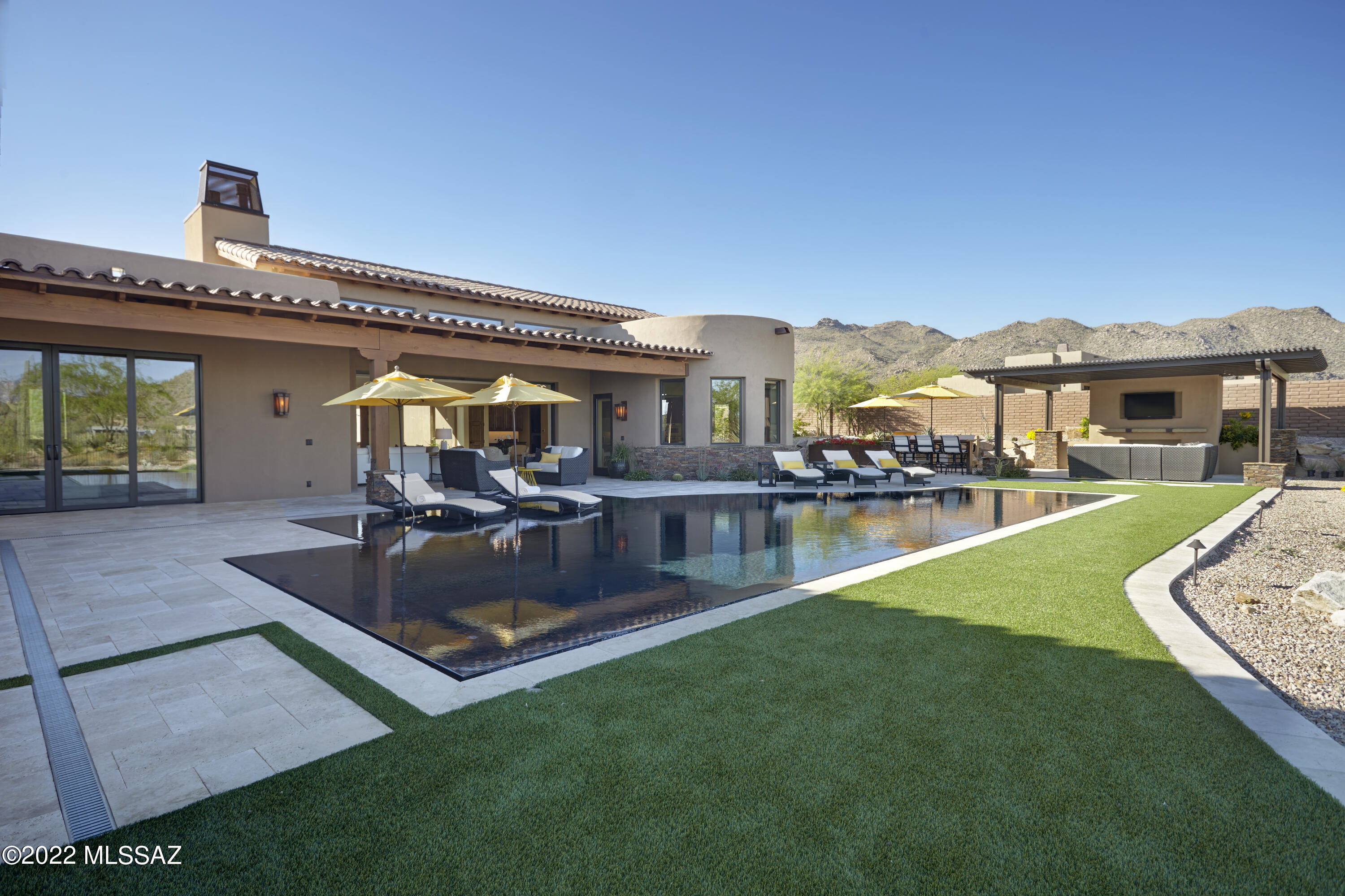 Incredible views are everywhere you look in this beautiful Custom Ritz Carlton Residence.  The main home has three large bedrooms and an oversized den.  The backyard has a 360 degree spillover pool and large casita that your guests will never want to leave. Come enjoy the Ritz Carlton lifestyle.