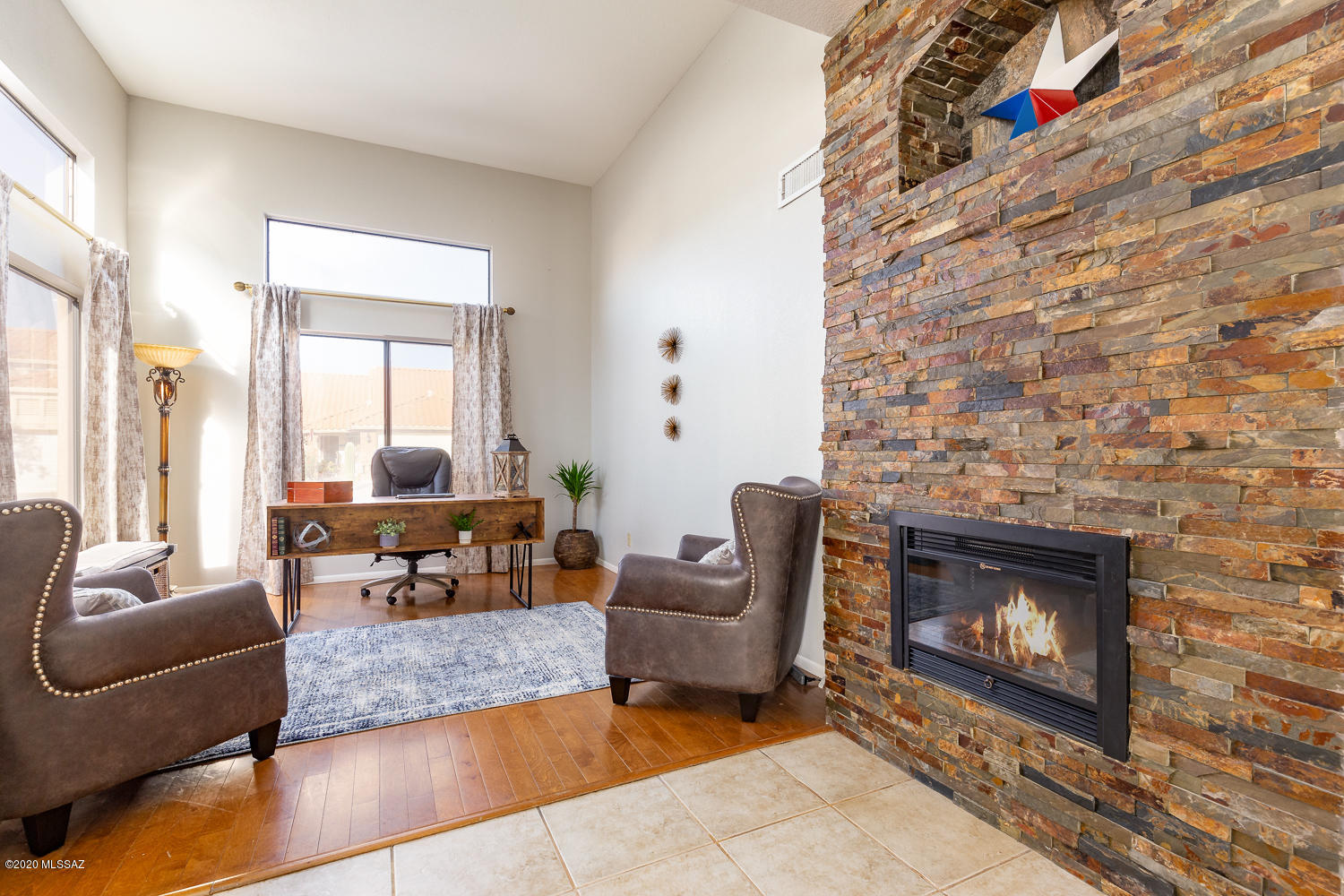 3/2 + Home Office/Den with just- completed updates! Vail Schools+ NO HOA! Contemporary Color Palette + so much to love. New Interior Paint thru-out. Set the table in style in the elegant Dining Room, set into a beautiful Bay Window. The stunning Stacked Stone Fireplace & Bar Niche add to the ambiance! Kitchen is open to Living, with NEW dark gray Solid Surface Countertops, & just-Resurfaced White Cabinets. Enter the Master Bedroom through Solid Wood Vintage Double-Doors. Newly painted Black Cabinets + Black Fixtures in Master Bathroom! Vintage doors & special lighting continue thru Hall. New Carpet BR3. High Ceilings & Clerestory windows. Ez Care Turf + Brick Pavers extend driveway. All appliances stay. Shopping, Dining, Parks nearby. Poly piping has been replaced for you, with warranty