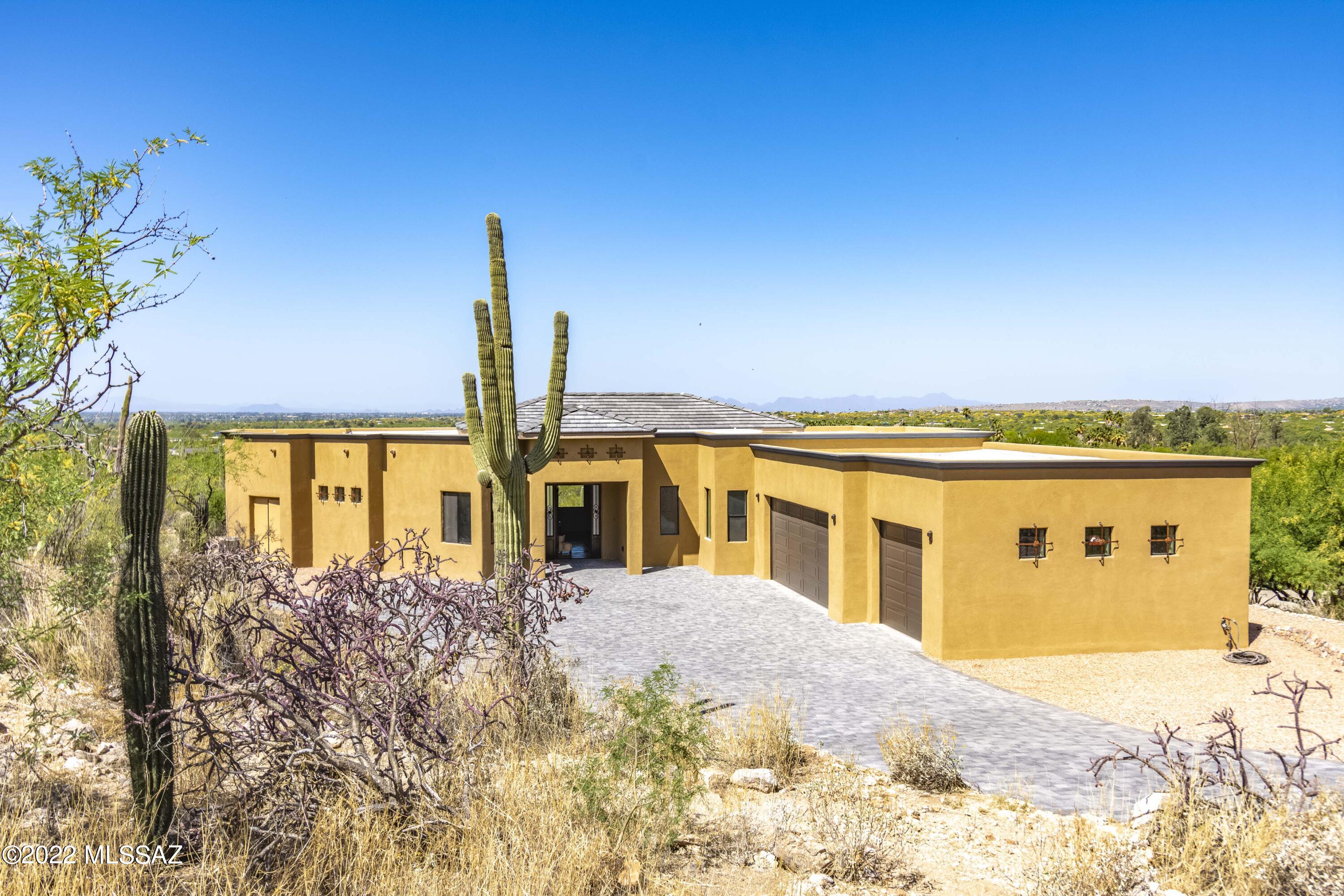 THIS IS IT! New Construction. It simply doesn't get any better. Dyed, scored concrete floors throughout, solid concrete block construction with stucco finish, 360 views, private location at the end of a Cul de Sac, overlooking Agua Caliente, the best park in Tucson. This is on the national register of historic places. Gorgeous, custom kitchen, amazing Primary suite with glassed in wet room, 2 additional Primary suites, large 3 car garage, views from every window in the home, $15,000 custom 9ft by 4ft Wrought Iron Entry Door, upgrade after upgrade. This is the best home I've seen in 40 years of living in Tucson. 15 minute drive to Tanque Verde falls, 5 minutes from 49er golf course, 50 minutes from MT. Lemmon Ski Resort, 35 minutes to Rose Canyon Lake stocked with rainbow trout, 10 minutes to Tanque Verde Ranch's 4 star resort with restaurant and horseback riding.