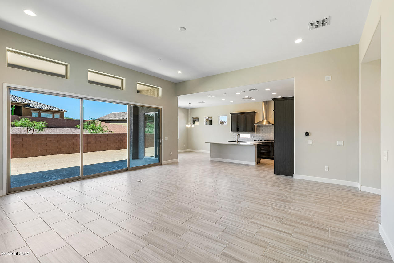 MODEL PHOTOS. Cimarron plan w Desert Contemporary elevation is complete & move-in ready! Home features open concept living with spacious kitchen & expansive great room with 15' glass slider to rear covered patio. Gourmet kitchen is a dream with granite counters, tiled back splash, 36'' gas cook-top, vented hood, Cherry cabinets & walk-in pantry. Enclosed den with French doors offer private space. Laundry includes cabinet storage. Master suite features walk-in shower w spa niche & huge walk-in closet. Additional features: Gas BBQ stub-out, pavered courtyard & portico, stop-n-drop with cabinet storage & more!