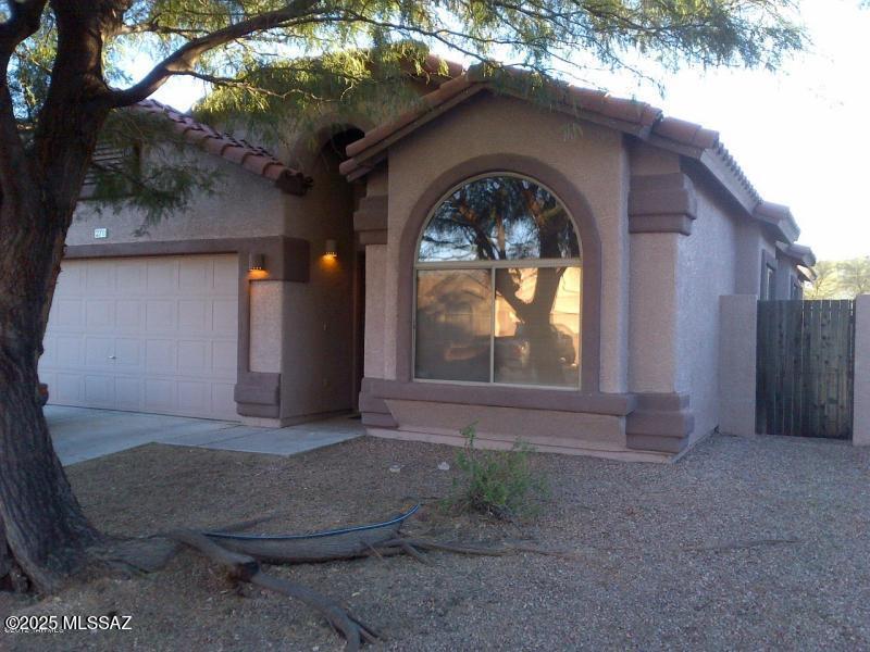 Discover comfort and style in this spacious 4-bedroom, 2-bath home in the sought-after Rancho Sahuarita community. Featuring an open floor plan and vaulted ceilings, this single-story home offers an inviting atmosphere with abundant natural light. The eat-in kitchen, complete with a central island, is perfect for gatherings. Relax in the master suite, featuring a shower/tub combo for added comfort. With washer/dryer hookups and a thoughtfully designed layout, this home blends functionality with modern living. Enjoy all the amenities of Rancho Sahuarita, including parks, walking trails, and community events. Don't miss this opportunity—schedule your tour today!