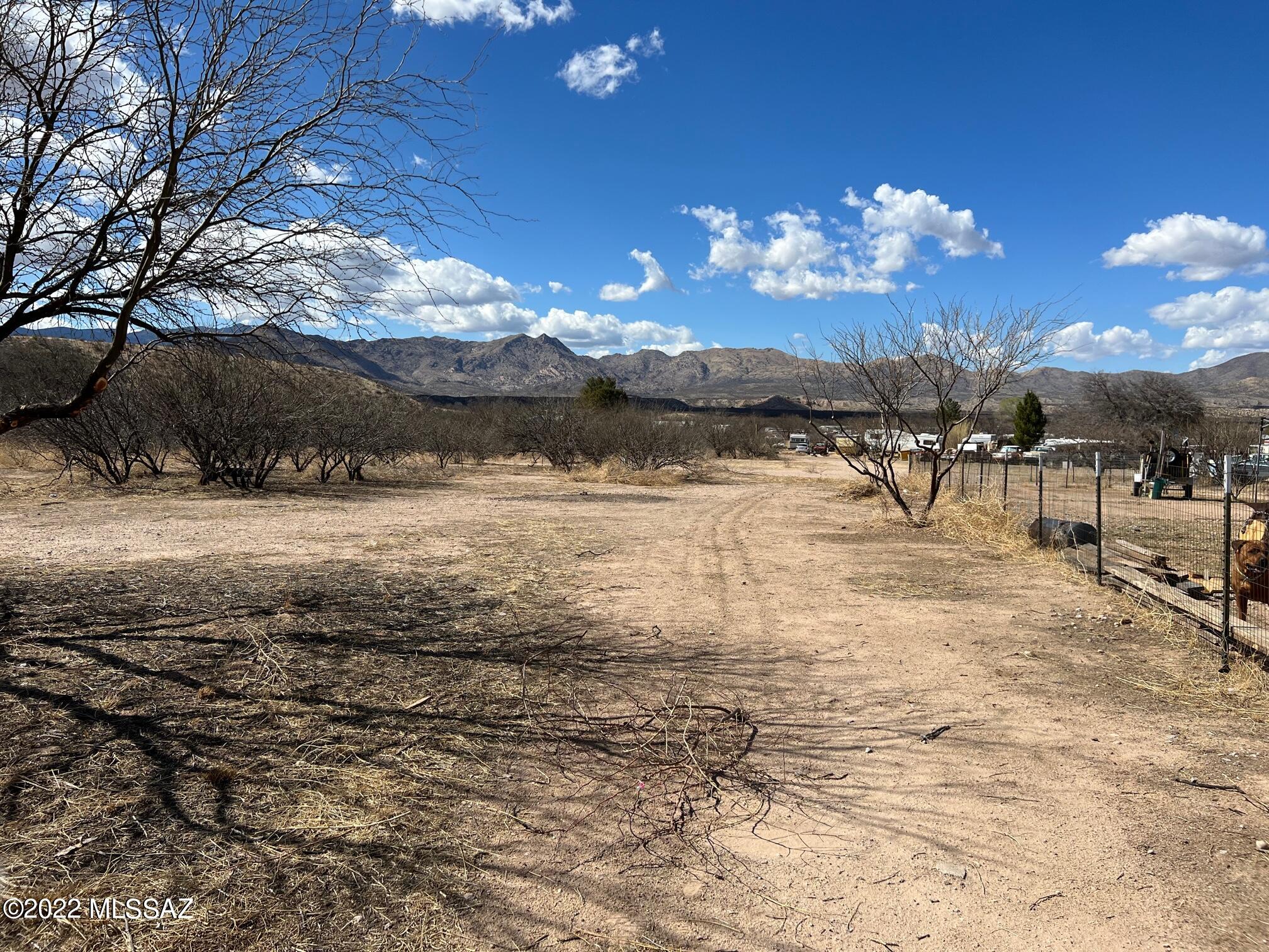 Vacant lot with water and electric  to the lot line. A few miles north of town, nice view of the Rincon Mtns from the lot.  A few mesquites on the property, all on a paved road.