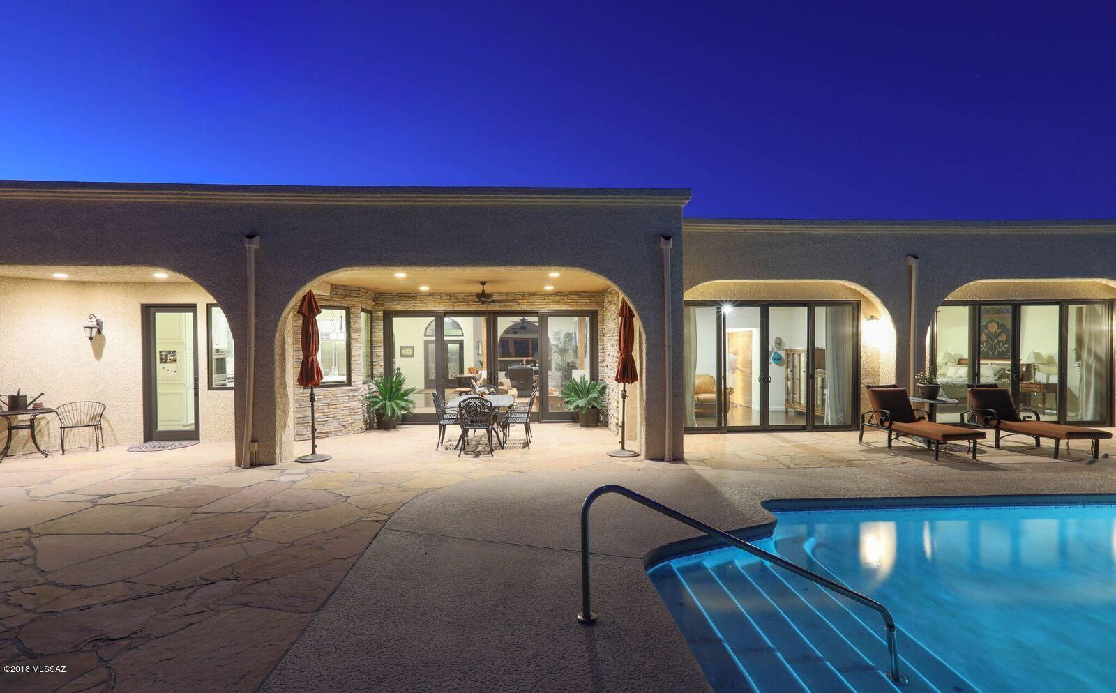 Located in the understated gated community of Canyon View Estates, awaits this comfortable well done custom home, all on one level. Offering an open/bright great room concept with gourmet kitchen, beamed ceilings, frpl, and beautiful wood floors opening out to an expansive patio and entertaining areas. The Gourmet kitchen offers quartz counter tops and island with stainless steel Bosch double ovens, and Wolf 6 burner gas cook top, Subzero refrigerator, microwave and dishwasher. This stunning home is perfectly situated to take advantage of the sweeping view of the mnt, city, sunrise/sunsets.  There are 4 large bdrooms each with baths.  The bckyd offers a large sparkling pool, frpl, BBQ with flagstone and charming covered patio. Remodeled completely with taste and refinement.