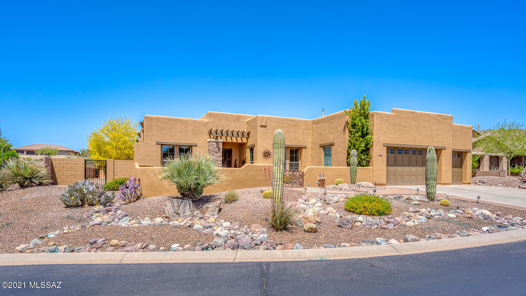 Beautiful Santa Fe Sabino model sited on spacious lot backing to desert has 2 Bedrooms, 2 ½ Baths, Den + custom pool. Welcoming courtyard is ideal for relaxing & enjoying mountain views. Entering, you are drawn into the spacious Great Room overlooking the pool w natural desert beyond. Large island kitchen w plenty of cabinetry, granite counters & stainless appliances including gas cooktop. Spacious owners' suite overlooks the pool & has en-suite w double vanities, soaking tub, separate tiled shower + walk-in closet. Private guest suite has en-suite. Convenient den, powder room, ceramic tile except in bedrooms + 3 car garage. Entertainers delight awaits outside w beautiful pool & spa, raised viewing deck, plenty of hardscape, & mountain views. Come enjoy the SaddleBrooke Preserve lifestyle