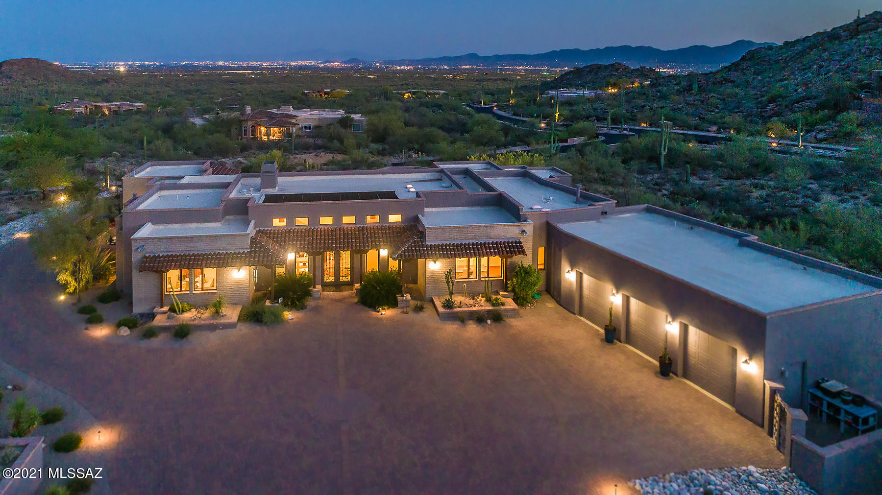 Spectacular custom estate is nestled against the Tortolitas in the luxury, gated community of Canyon Pass at Dove Mountain. Boasting panoramic mountain and city light views, this luxurious 3BD/5BA (4,595 sq ft) home incorporates dual Master suites, private guest casita, Great room/Media room/Office, formal dining room w/wine closet, a wet bar and 2 fireplaces. Stunning open concept plan is accentuated by soaring beamed & coffered ceilings, skylights, plus Travertine flooring & wall accents. Gourmet kitchen hosts granite slab countertops, alder cabinetry, luxury appliances & butler's pantry. Relax outdoors with a linear firepit, outdoor kitchen, plus solar or gas heated pool with spa & waterfall. Experience the open desert setting from this expansive lot while enjoying awe-inspiring views.