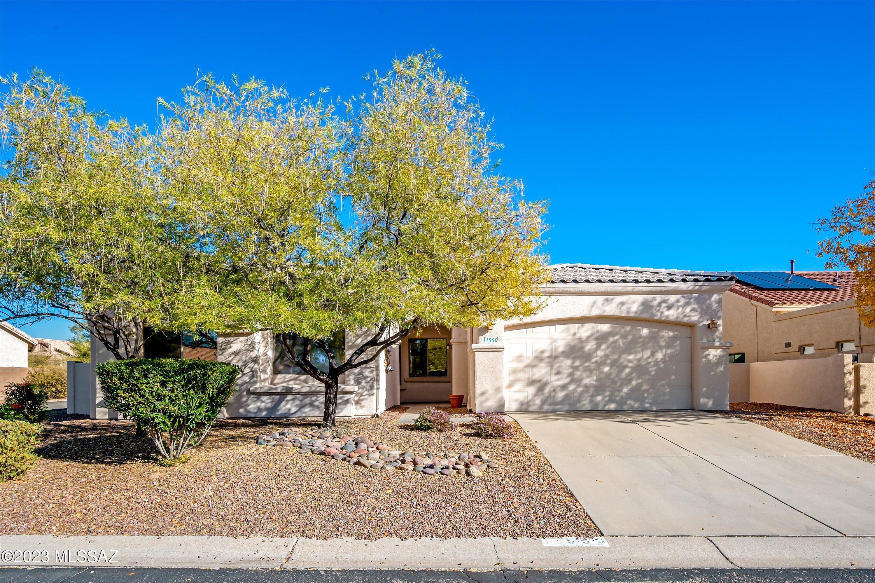 Wonderful golf course setting with Catalina Mountain views. Enjoy this split floor plan with 3BR+Office and 2 full baths. Amenities include maple cabinetry, black granite counters and all appliances stay, upgraded tile throughout except bedrooms, fireplace has arched concrete surround, and French door off primary bedroom to shady east facing patio. Large covered back patio with custom designed brick pavers. Deep Tandem 3-car garage has many uses for storage, workshop, golf cart, etc. Minimal yard provides for carefree lifestyle or perfect second home. More photos, floorplan, virtual tour available in documents for additional property information. Listing agent related to Seller.