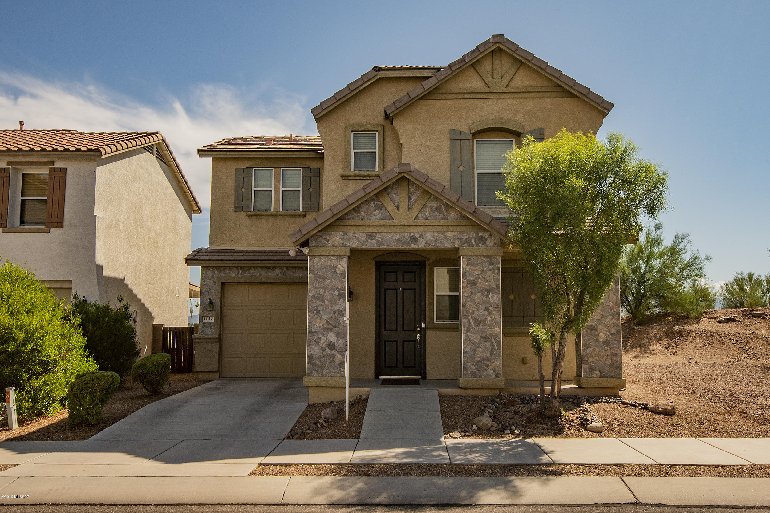 Striking  two-story home with open floor plan situated in the – Pantano Overlook community.  A turn-key 3bed/3bath home, seller purchased directly from the builder, Pride of Ownership is immediately evident.  Guests are welcomed by a stack stone entry with custom designer paint.  Property appointments include ceiling fans throughout, downstairs bath for guests with spacious kitchen equipped with gorgeous views courtesy of this Premium Lot.  Covered back patio with brick pavers, chic back yard and ''Green'' landscaping make this backyard with endless views a true entertainer's delight.