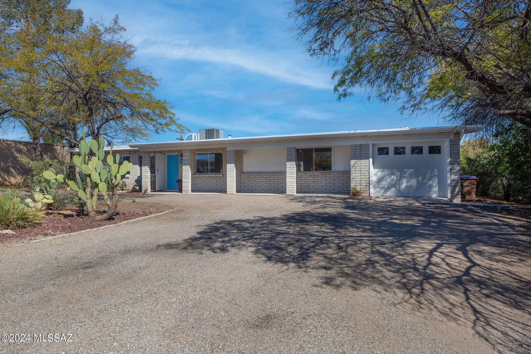 Don't miss out on the opportunity to live in New Day West, a highly desirable neighborhood in West Tucson, close to various amenities such as shopping, dining, entertainment, and recreational activities. Additionally, it's near Pima Community College's West campus and the University of Arizona. 

The house was built in 1976, and it's a ranch-style home made of slump block. With 1,667 square feet, it has two bedrooms and two bathrooms. The property is situated on a .30-acre lot, which provides mountain views. Furthermore, there's enough space for RV parking and guests, making it an ideal home for those who love to entertain.

This beautiful house has been updated and is move-in ready! Soft neutral tones maintain the light and bright ambiance, and the floor plan provides comfortable living and is ideal for entertaining. Ceramic tile flooring throughout the house makes it easy to clean and maintain.

The spacious family room is located right at the entrance of the house. It is adjacent to the open Kitchen, which has an adjoining sitting room with a beehive fireplace, and space for dining. There is also a sizable rec room off the kitchen, which can be utilized in different ways based on your family's needs. Moreover, there is a large laundry room with a closet for the washer and dryer, and the workshop and garage can be accessed from here.

The secondary bedroom boasts stunning mountain views and a walk-in closet. The adjacent hall bath features a shower and tub combo and a single-sink vanity. The primary bedroom includes a walk-in closet, an ensuite bath with a walk-in shower, and a sliding glass door that leads to a shaded area for private enjoyment in the rear yard.

Whether you're relaxing or entertaining guests, you're bound to fall in love with the Arizona room, which offers stunning mountain views and a bonus room with a mini-split that can be utilized as an office or studio. The enclosed backyard features an expansive ramada, providing ample shade for outdoor enjoyment, while the backyard space offers plenty of room for a pool, play system, trampoline, and outdoor toys. Additionally, the backyard has access to the workshop. If you require additional space, there is an enclosed rear yard bordering the alley that can be utilized. There is No HOA here!

This beautiful home is ready to welcome you, and have you make it your own!