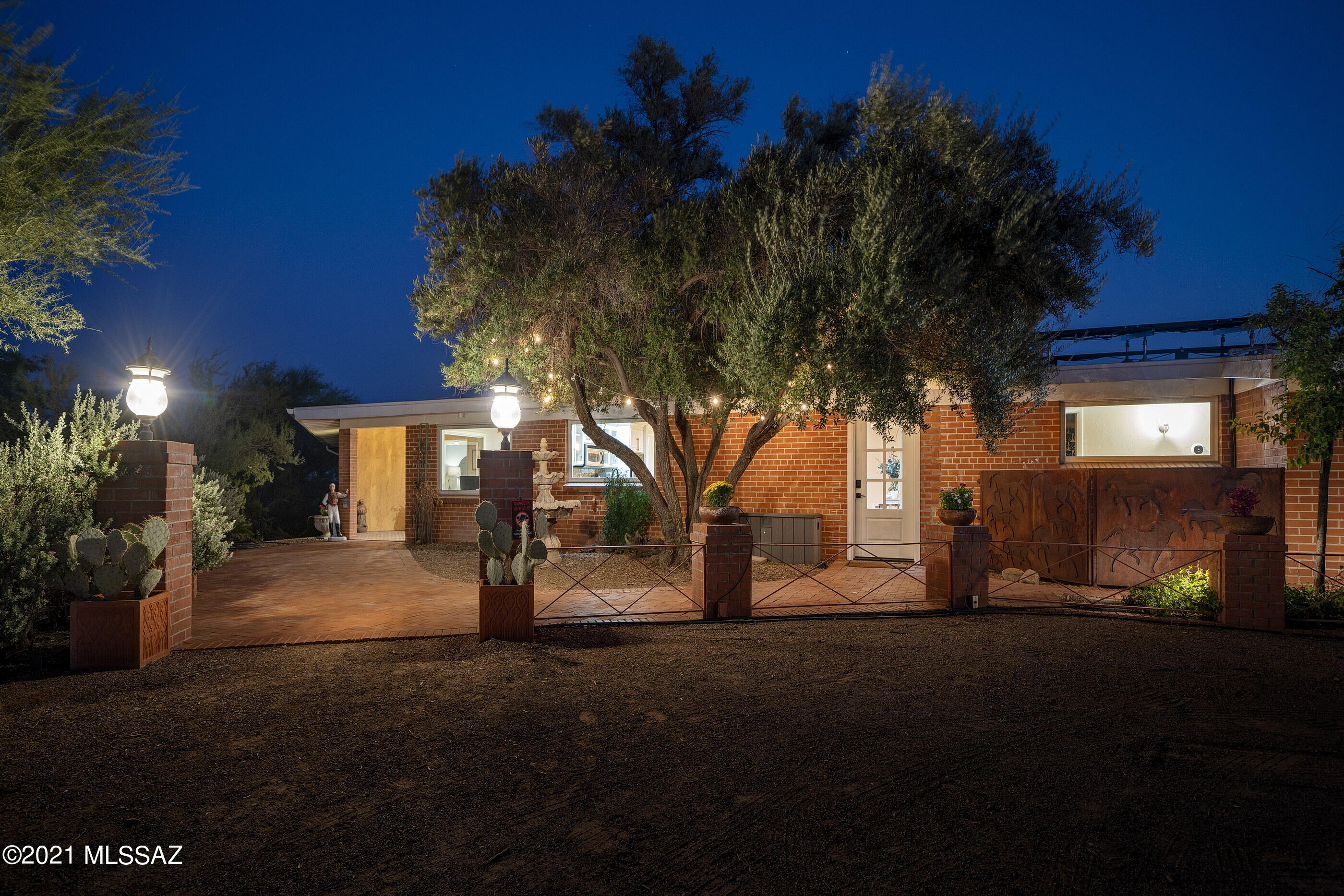 Hummingbird Hill is perched on a 7 acre parcel near Swan/River and whether you want just privacy and space or to jump on your horse and ride, this home could be the one.  Updated farmhouse boasts a chef's kitchen, beautifully updated living spaces including huge family room and four bedrooms, split plan.  Add a separate work out room, a sauna and one bedroom guest apartment off the expansive covered porch overlooking the pool and entertainment area that faces south for amazing views and sparkling lights.  Step over to the crow's nest for another private viewing spot. Horse facilities with arena and stalls and paths to the Loop – off you go for miles.  Owned solar, four car garage, two car carport too.