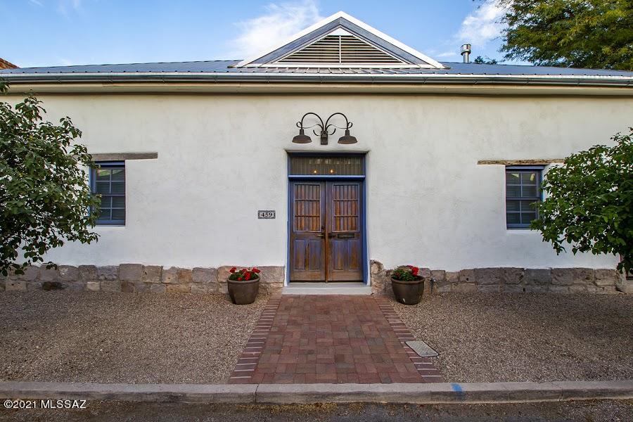 Absolute jewel in Tucson's oldest neighborhood, Barrio Viejo. Rarely does a house of this quality become available. This
1898 adobe treasure has been lovingly and thoughtfully restored, brought to pristine condition, with every nod to its
historic heritage. The zaguan entryway and living room have soaring ceilings boasting original saguaro ribs and exposed beams. Incredible attention to sustainability, such as double 800-gallon water-harvesting tanks, on-demand hot water, and whole house reverse osmosis water treatment. Attention to comfort includes radiant heat in the master bath floor and a heated towel rack. The master bedroom is stunning with a
cathedral ceiling. Formal dining room, chef's kitchen, two art studio/bedroom spaces. The casita is easily converted to a guesthouse. Cont.