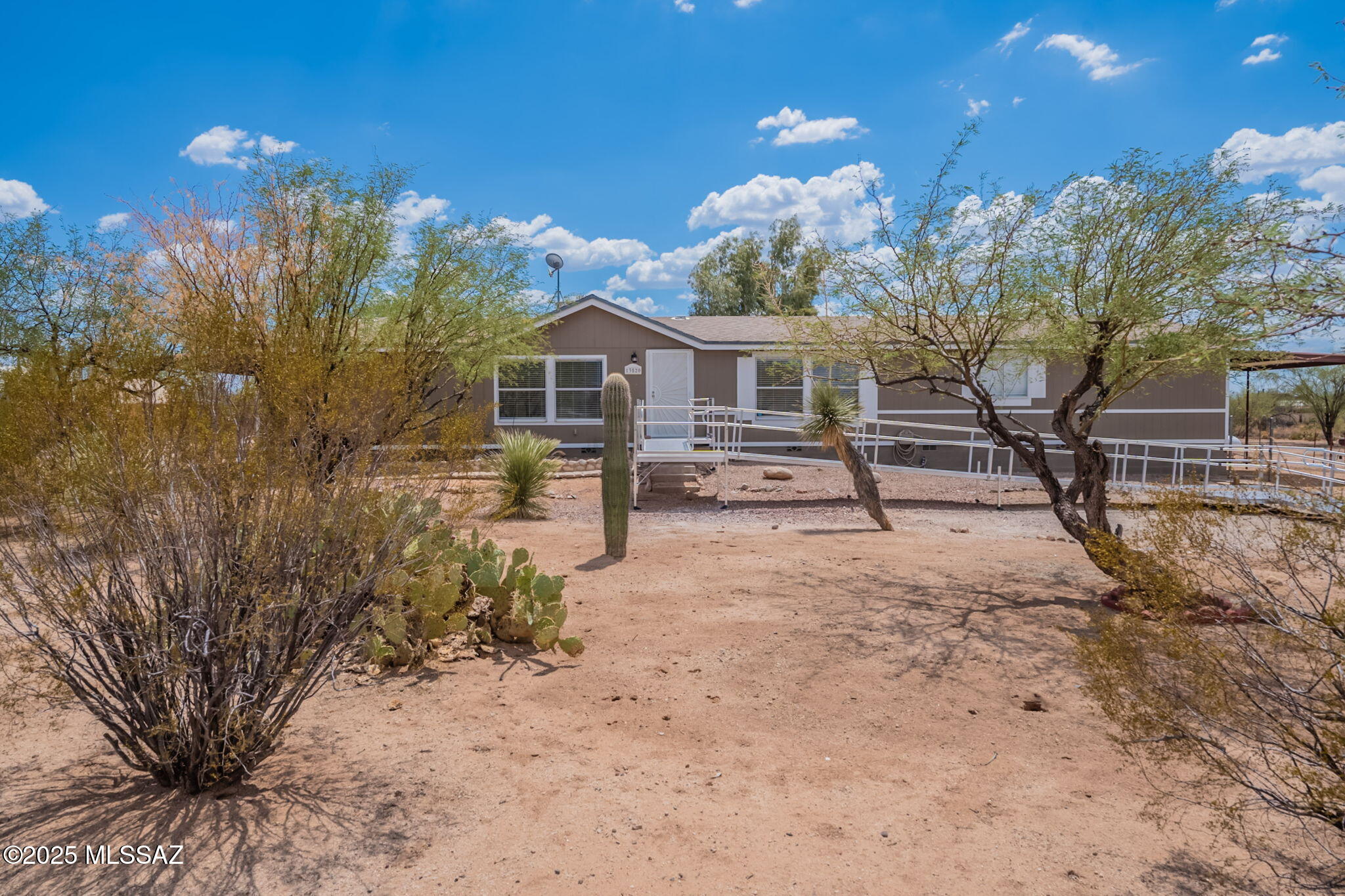 Range priced *** Seller will entertain offers between $299000-304900 *** Come home to tranquility and stunning desert views in every direction. This property offers a fully fenced yard and a flat, usable landscape—perfect for a garden, horses and animals, or RV/boat storage.
The spacious manufactured home features an open, split floor plan with a family room just off the kitchen, plus a formal living and dining area. Enjoy outdoor living on the covered back patio. 
Semi-circular driveway with easy front and rear access. Shared well at just $25/month.
Outbuilding has power and electric! 
Enjoy the quiet of country living with convenient access to nearby services. Fresh paint, flooring and updates galore! Don't miss this desert gem!