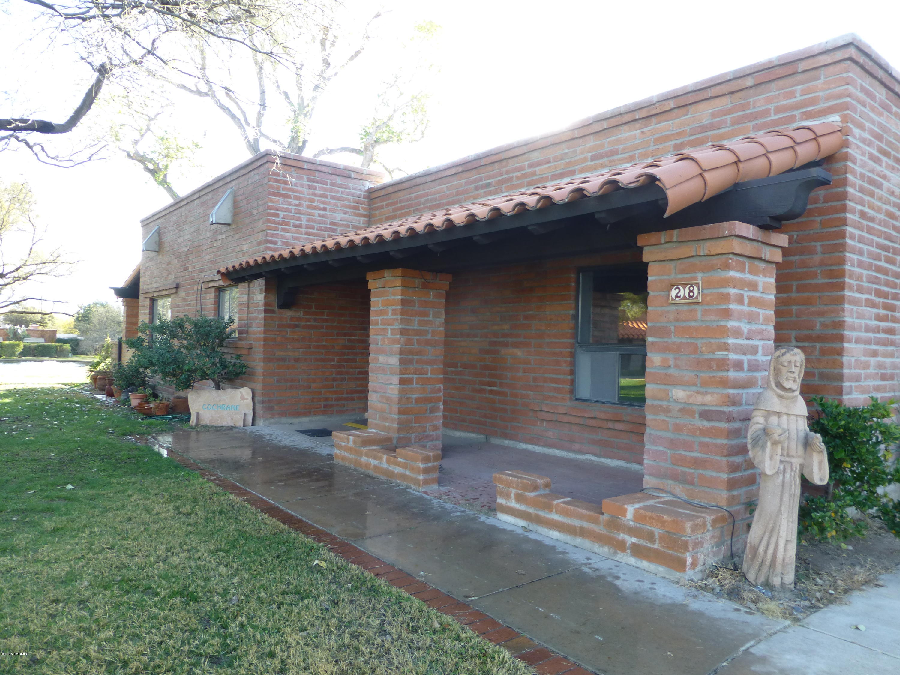 Amazing location! Surrounded by green grass and mature trees. Golf course and lake views out of nearly every window. 2 Bedrm 2.5 bath, Great room with high wood beam ceiling, skylights, Wood burning Beehive Fireplace, Loads of windows, Loads of storage and a 2 car garage. Relax on one of the covered patios and watch the golfers, stunning vistas. Gorgeous!