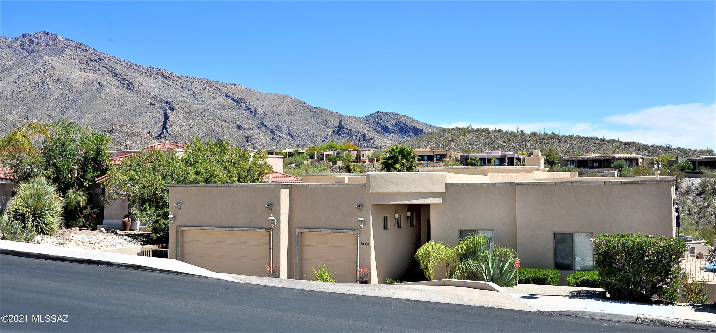 Incredible location in the Catalina Foothills. Regal Manor Dr. is one of the most popular streets in the foothills.  Tremendous Mountain views with walls of glass to view through.  This spectacular floorplan has 4 bedrooms and 5 bathrooms with each bedroom having its own private bathroom. Refinished kitchen cabinets with crown molding, glass upper cabinets, granite countertops, undermount sink, spray faucet and gorgeous tile backsplash.  Large pantry and an Island bar to seat 6.  All stainless steel appliance to include:  Gas double oven with cooktop, Hood, DW. Master suite is very large, incredible views, two vanities with framed mirrors, granite countertops, undermount custom sinks, oversized shower with rain faucet and jetted tub. Walk in closet. Two family rooms, fireplace Ceiling fans and a three car garage. Rear yard oasis with Heated pool and spa. Beautifully lit pool at night boasting many colors.
Oversized covered patio, flagstone extended patio, Built in BBQ with cooktop, and a play area with grass. New water heater, roof in great condition. Freshly painted interior, wood doors throughout and ceiling fans Large Laundry room with upper cabinets.
Minutes from upscale shopping, restaurants, resorts, hiking, and Golf. District 16 schools. Vacant lot next door is available for purchase. Call for details