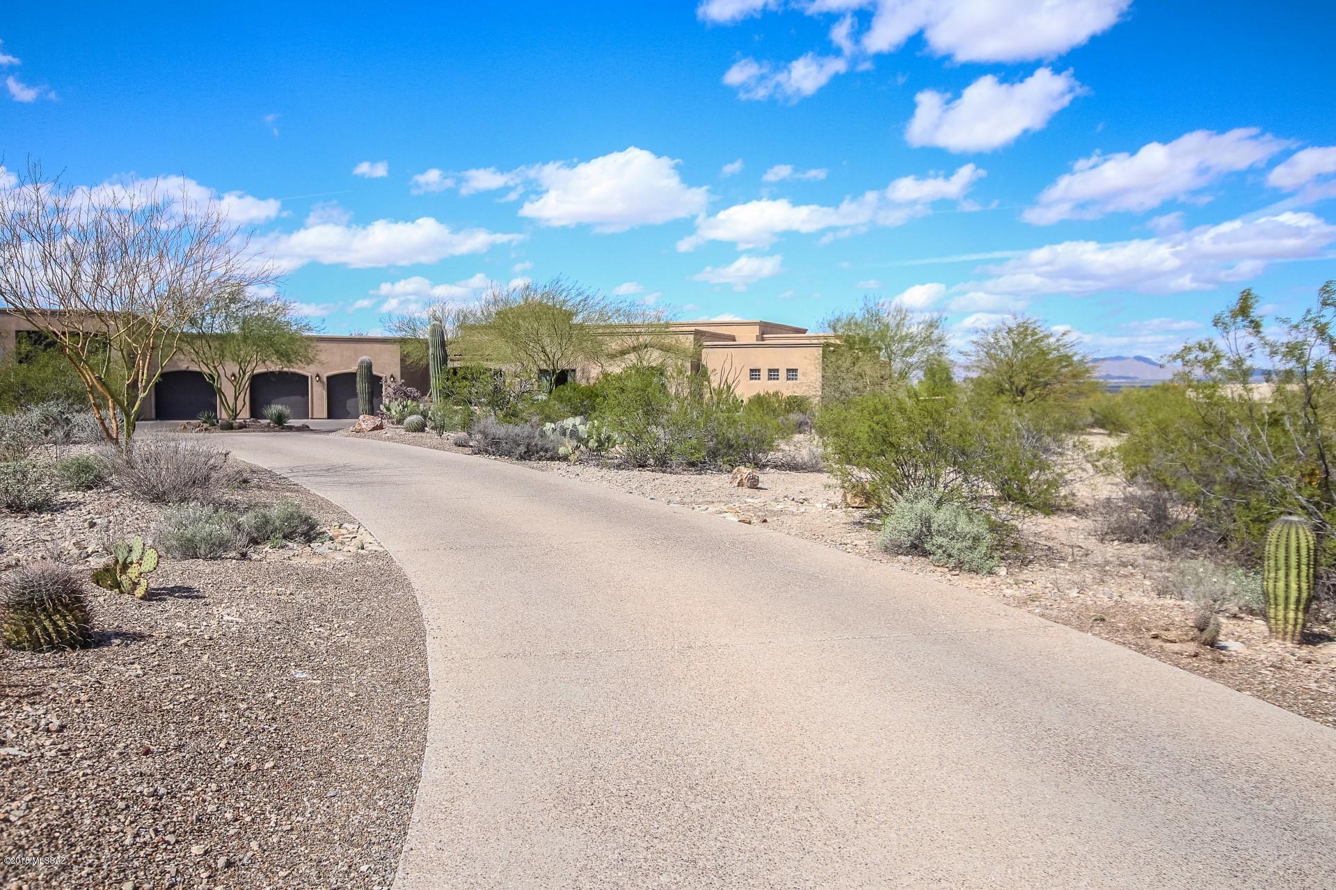 Seller to accept offer,cntrs within range.Outstanding Custom Luxury Home w/ circular driveway,3 car + RV garage & private courtyard entry.Amazing Hilltop Views & desert landscape.Welcome to the Gated Community of Tucson Mountain Reserve.Corinthian stone columns, Versailles pattern travertine honed & chiseled floors,art niches, magnificent limestone fireplace, upgraded lighting & built-in entertainment shelves.Stunning gourmet kitchen features knotty alder wood cabinetry w/ stylish hardware,granite counters,breakfast bar,prep sink,high end SS appliances & backyard views from breakfast area. Formal dining room.Perfect Home for entertaining inside & out.Master retreat offers Mtn views,patio access and spa-like en suite w/jetted tub.RV hook up inside garage & room for work shop equipped w/220 with utility sink. Plush neutral carpet in all the right places. Spectacular backyard boasts extended covered patio, exterior fireplace, built-in BBQ, and sparkling pool w/spa. See it...Love it...Live it!!!