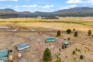 Adorable Turn-Key Home with Panoramic Mountain Views - Alpine, AZ Charming, super clean, and move-in ready—this 2-bedroom, 2-bath 2005 manufactured home sits on a full acre in the heart of Alpine, surrounded by breathtaking mountain scenery. Nestled at the base of the forest and located just off US Highway 180, this property offers the perfect blend of seclusion and accessibility.  Inside, enjoy a spacious great room, separate dining area, and a large, fully equipped kitchen. Offered fully furnished, this turn-key home also includes a carport, utility shed, and RV parking with hookups and a dump station. Recently re-leveled and topped with a newer roof (2024), the home is in excellent condition.

Situated within a small, gated area shared with just three other residences, you'll enjoy peace and privacy while still being minutes from Alpine's town center. City water with sewer available.

Whether you're seeking a year-round residence, vacation getaway, or income-producing rental, this property offers incredible potential. Alpine is renowned for its world-class hunting, fishing, hiking, biking, and off-road adventureswith Sunrise Ski Resort just 40 minutes away.

Don't miss your chance to own a slice of paradise in Arizona's White Mountains. Call today for a private showing!

Seller is in the process of getting the Affidavit of Affixture application completed.