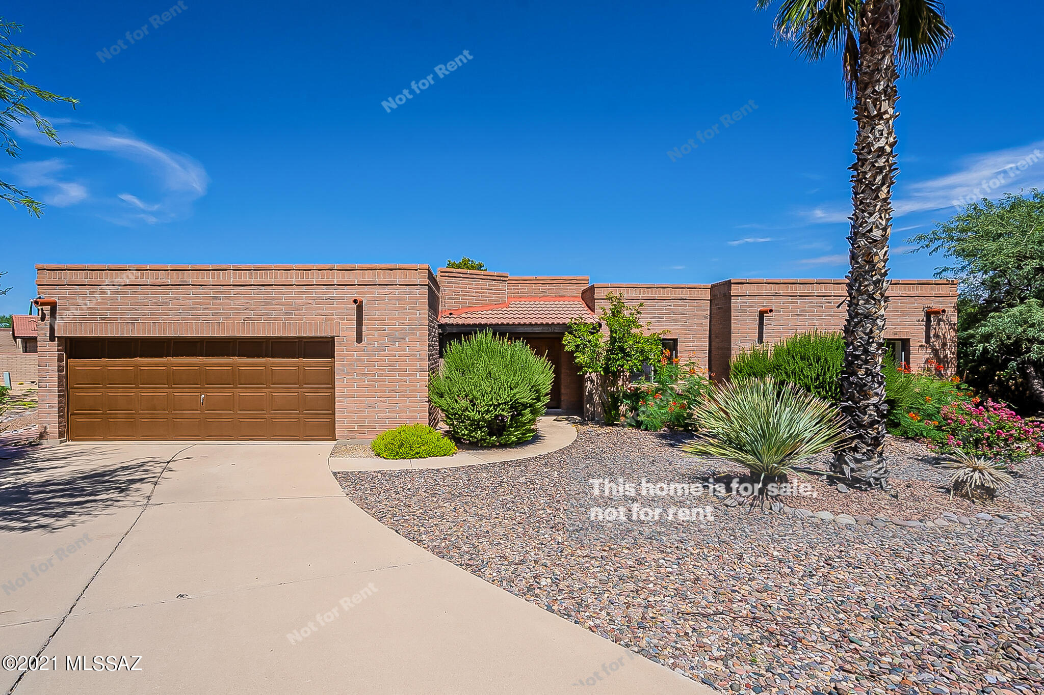 This Green Valley one-story home offers an in-ground pool, a patio, and a two-car garage.