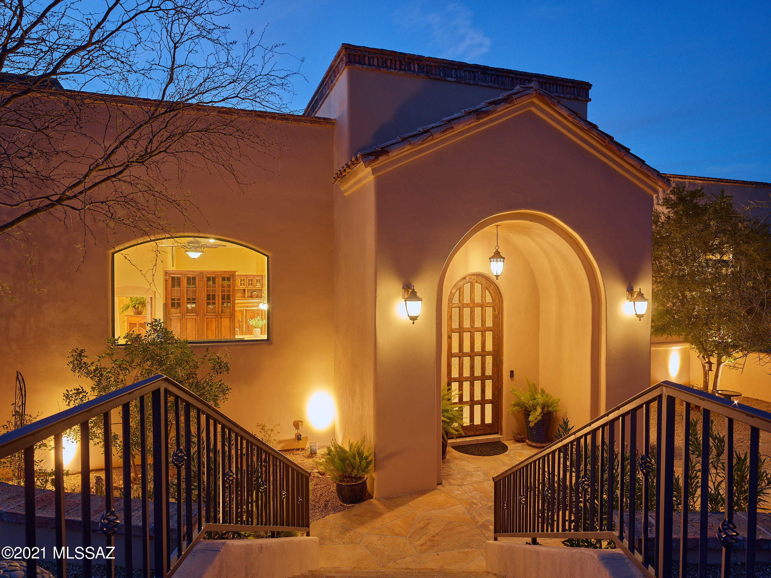 This truly stunning Mediterranean style home is a rare Arizona find and a MUST SEE to appreciate! Breathtaking views of the mountains and sunsets from every window and terrace. The craftsmanship and quality of this build and the finishes are apparent as you enter a warm and welcoming great room with sky high ceilings, natural light, travertine floors, and Cantera stone fireplace and accents. A chef's dream kitchen with 10'+ tall glass paneled cabinetry, huge island, limestone counters, and GE monogram appliances. The master suite has its own private floor of the home and is a retreat in itself. Private terrace off the master has a spa and outdoor shower. Infinity edge pool to sit and watch the sunsets plus a grassy serene backyard with blooming flowers. Tour today!