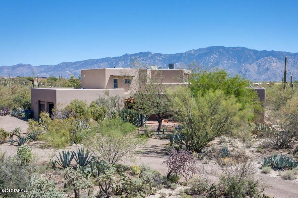 Fantastic Family Home with views and acreage! High Quality Authentic Southwest Custom 3,551sf 3BR/4BA home + 1BR/1BA 875sf guest casita. Magnificent views of Catalina, Tortolita Mtns. & city lights! 7+ acres. Shareholder in prestigious La Cholla Airpark. Plenty of room for horses. arena, RVs, planes and toys. Equestrian trails near. Sunset views & outdoor living w/large east-facing wrap-around covered patio and upstairs balcony, heated pool w/diving board & spa. Entertain inside & out w/ open floor plan feat. family room off kitchen, casual dining area, formal dining area, office, loft & spacious upper viewing deck. Classic style w/Saltillo tile, Viga beams & stenciled Talavera tile. Extra large, 4car garage makes a great workshop space. Secluded yet close to shopping, restaurants & golf.