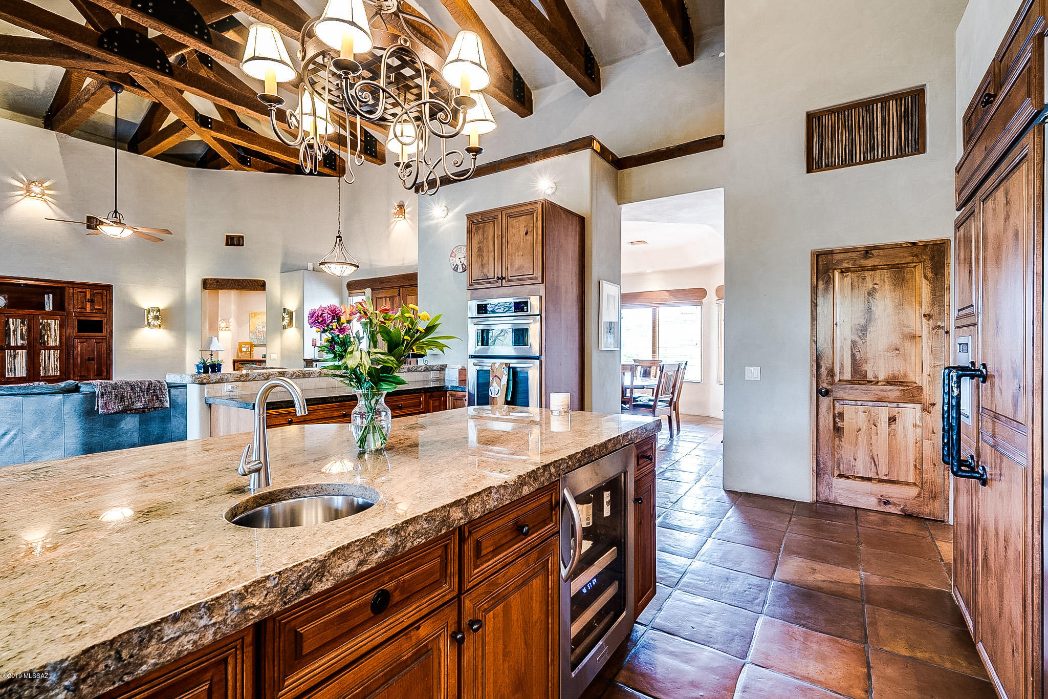 Beautifully designed custom home by Ray Birch. The details in this home are exquisite! Located in district 16 on 1.46 acres, horse property. The home is situated on a private lot with 360 views of Catalina mountains. Home consists of 4 bedrooms with a separate quest quarters currently set up and used as an exercise room. The beautifully designed great room opens out onto approx 1500 sq ft of covered patio with a fireplace and built in BBQ for entertaining overlooking the mountains. Nicely designed backyard with pool.
