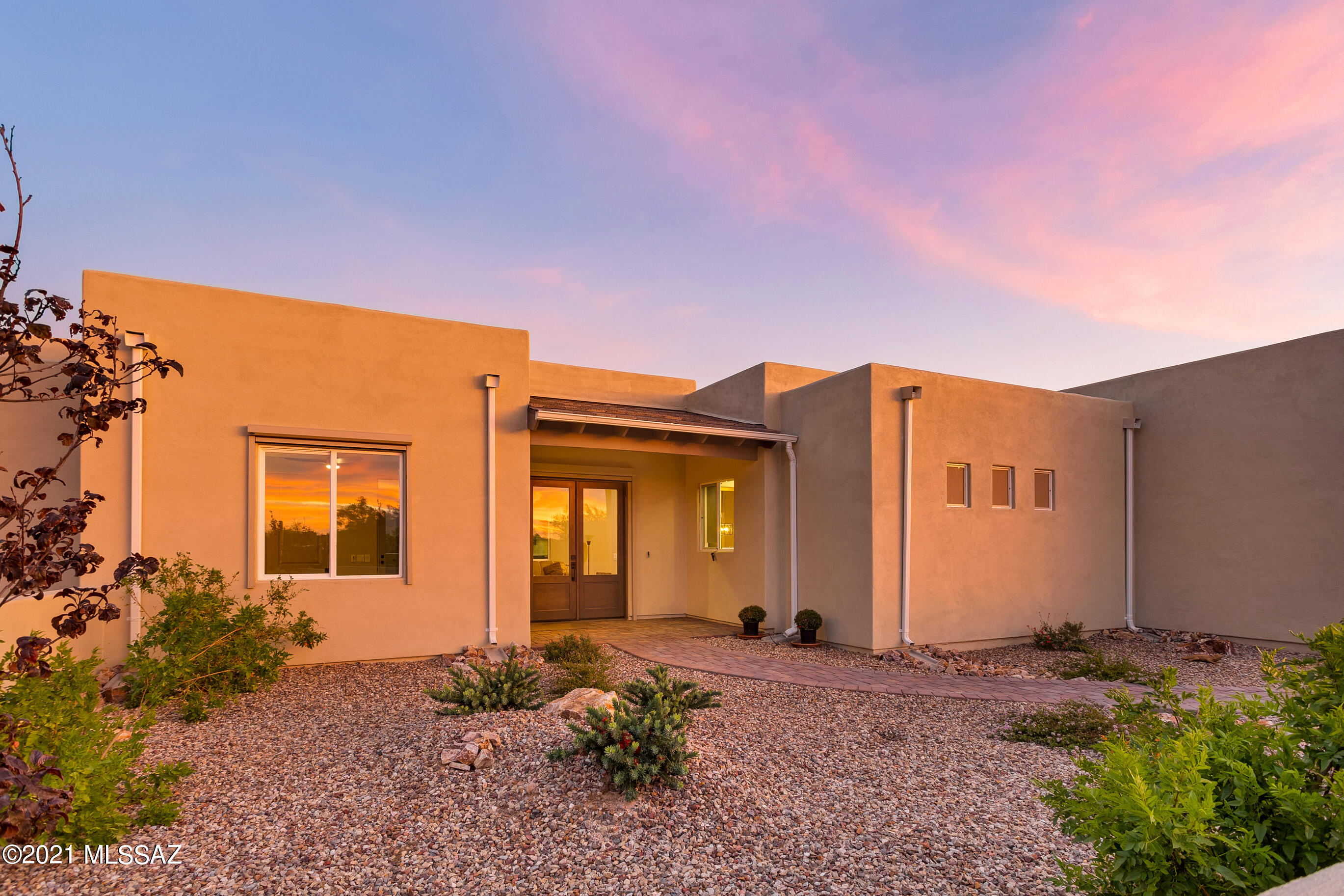 NEWLY CONSTRUCTED residence that has been CUSTOMIZED from the ground up! 4 bedrooms, 2 bath home situated on a very private 3.43 acres in the Tanque Verde Valley. Stunning 360 views. Large bright interior spaces with designer tile finishes. Well-appointed open kitchen with top-of-the-line appliances including induction stove. Granite and quartz counter tops throughout. All new electric solar shades reduce utility costs. Oversized 3 car garage w/ overhead storage, compacted RV parking pad w/ 50 amp power and water. Extended paver driveway, walkways and 100 ft+ wide rear patio. Whole home surge protector and water softener. Property boarders wash and common areas providing extra privacy, the residence is located in Tucson City limits w/easy access to Mt Lemmon and all conveniences. No HOA.
