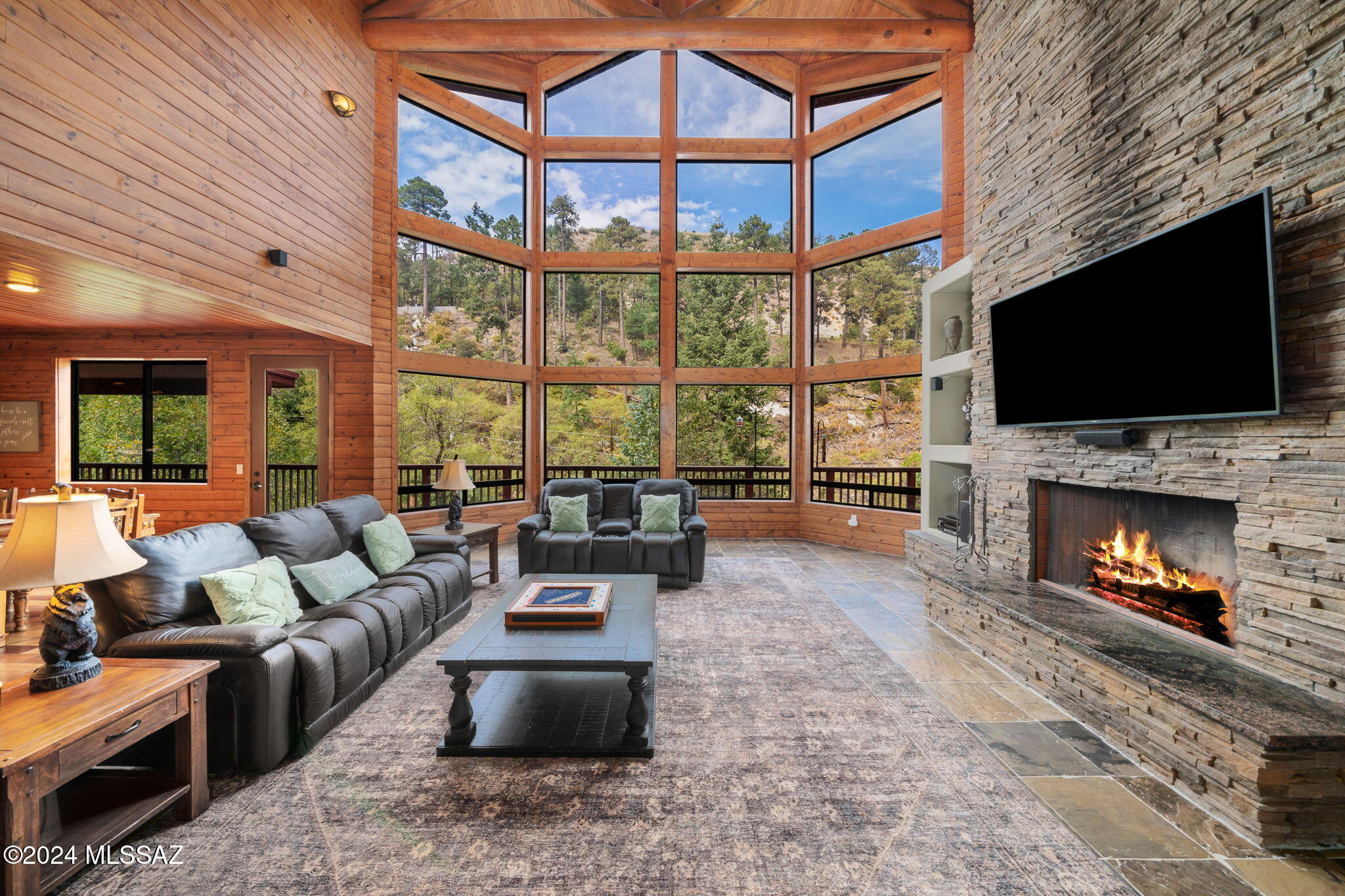 Escape to the cool, crisp air of Mt. Lemmon and step into this Mountain Sanctuary. This home is one of a kind and unlike anything that has EVER sold on Mt Lemmon!!! 5 min from Skiing, 15 min from Fishing, Quick 5 min walk to town where you'll find local bars, restaurant and little shops. Just an hour from Tucson makes this home an ideal retreat or can provide a lovely home for year-round living or coveted vacay getaway unlike any other. 
Pictures don't do this home justice its simply breathtaking in person- no expenses were spared in the building of this fabulous estate!