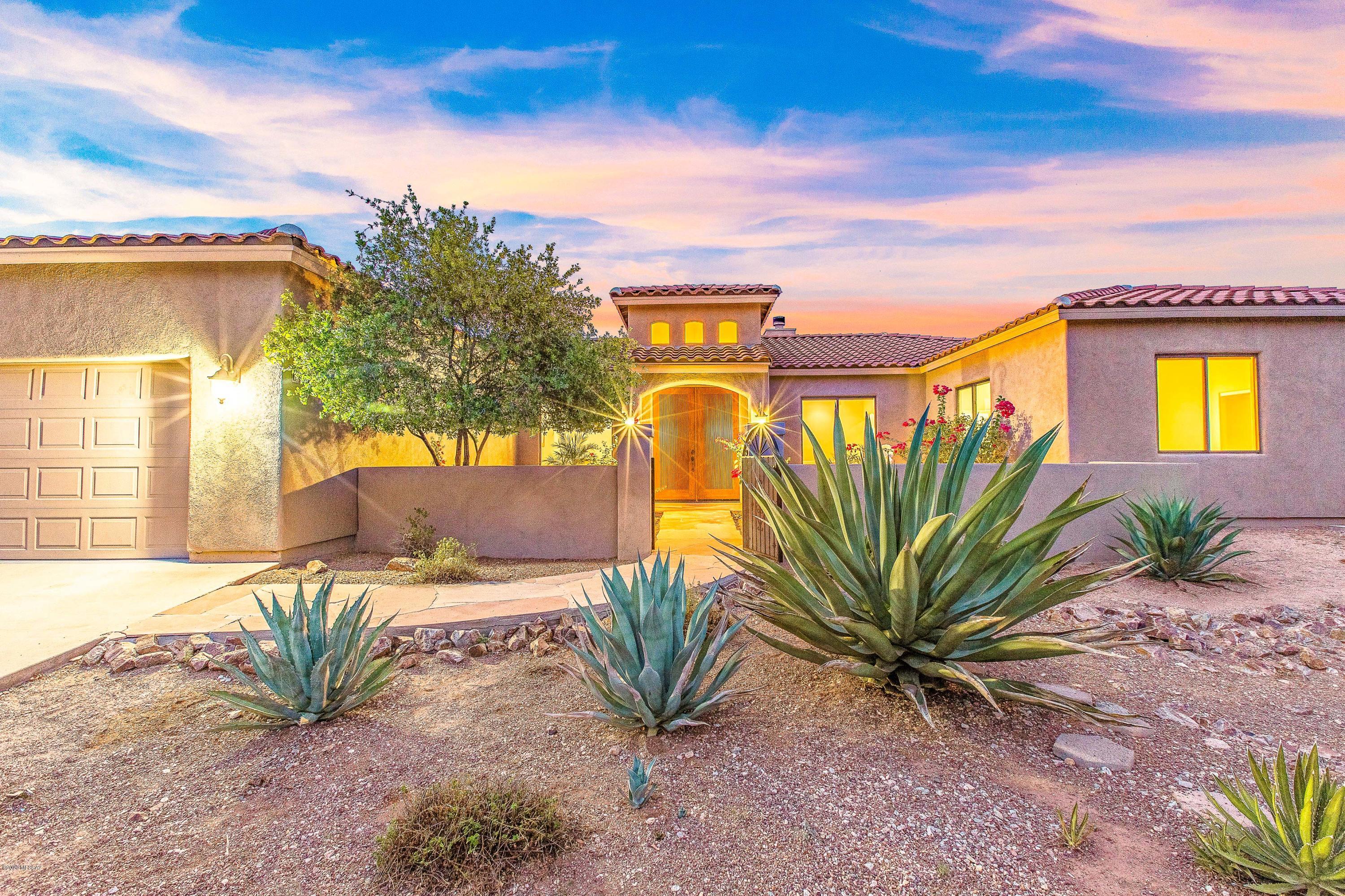 2005 Custom home located in the Catalina Foothills on a private 1.02 acre lot w/ unobstructed mountain views.  Enter through a beautifully landscaped courtyard into a grand entry w/ a formal dining & living room. Gourmet kitchen w/ center island & breakfast bar.  New SS appliances, granite counters & custom cabinetry. Huge pantry & desk area. Kitchen opens to huge great room w/ fireplace & informal dining area.  Sliding glass doors lead to deep covered patio w/ lighting & ceiling fans that spans the entire north side of home.  Striking Catalina Mountain views are the backdrop to this serene & peaceful backyard w/ jacuzzi, fountain & low care landscaping. Spacious master suite w/ doors to patio. Master bath w/ separate shower, garden tub & dual vanities w/ new granite counters.  CLICK MORE Huge walk-in closet will not disappoint!  On the opposite side of the home find "second master" ensuite bedroom, 2 additional bedrooms with a bathroom w/ dual vanities. Bonus room between these 3 bedrooms could be used as TV room, play room, kids homework area or whatever you may need.  Extra large storage closet in the common area. Spacious laundry room w/ storage & utility sink.  Oversized 3- car garage.  Incredible location close to Tucson's finest restaurants, shopping, world-class golf resorts & Sabino Canyon.  Close to Basis Charter School, Castlehill, the Gregory School among others! Prior to listing this home was painted inside and out, new carpet, new wood tile in dining and living room, new granite counters in all bathrooms & new SS appliances.
