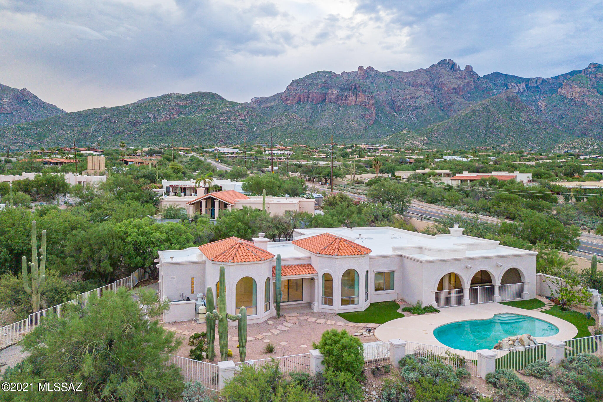 Stunning Gary Almli built home at end Of private drive with 0.67 acres land.  No HOA. Walk To Manzanita Elementary School. 4 BDR plus a den w/ 3 full BA. Lovely front courtyard.  Dramatic high Ceiling in living rm, family rm and master BDR.  Picture wall windows.  Two exquisite gas fireplaces are located in Family RM and Master Suite.  His/Her vanity.  Master BDR with a den which can be used as an office or a nursery rm.  Gourmet island kitchen w/breakfast area. Neutral Decor with Ceramic Tile & beautiful wood FLRS.  Central vacuum.  Covered Patio & Mature Citric tree. Beau pool w/water falls. Spa hookup AVAI.  Top City & Sunset Views. Well maintained. Closing to La Encantada mall. School district 16.