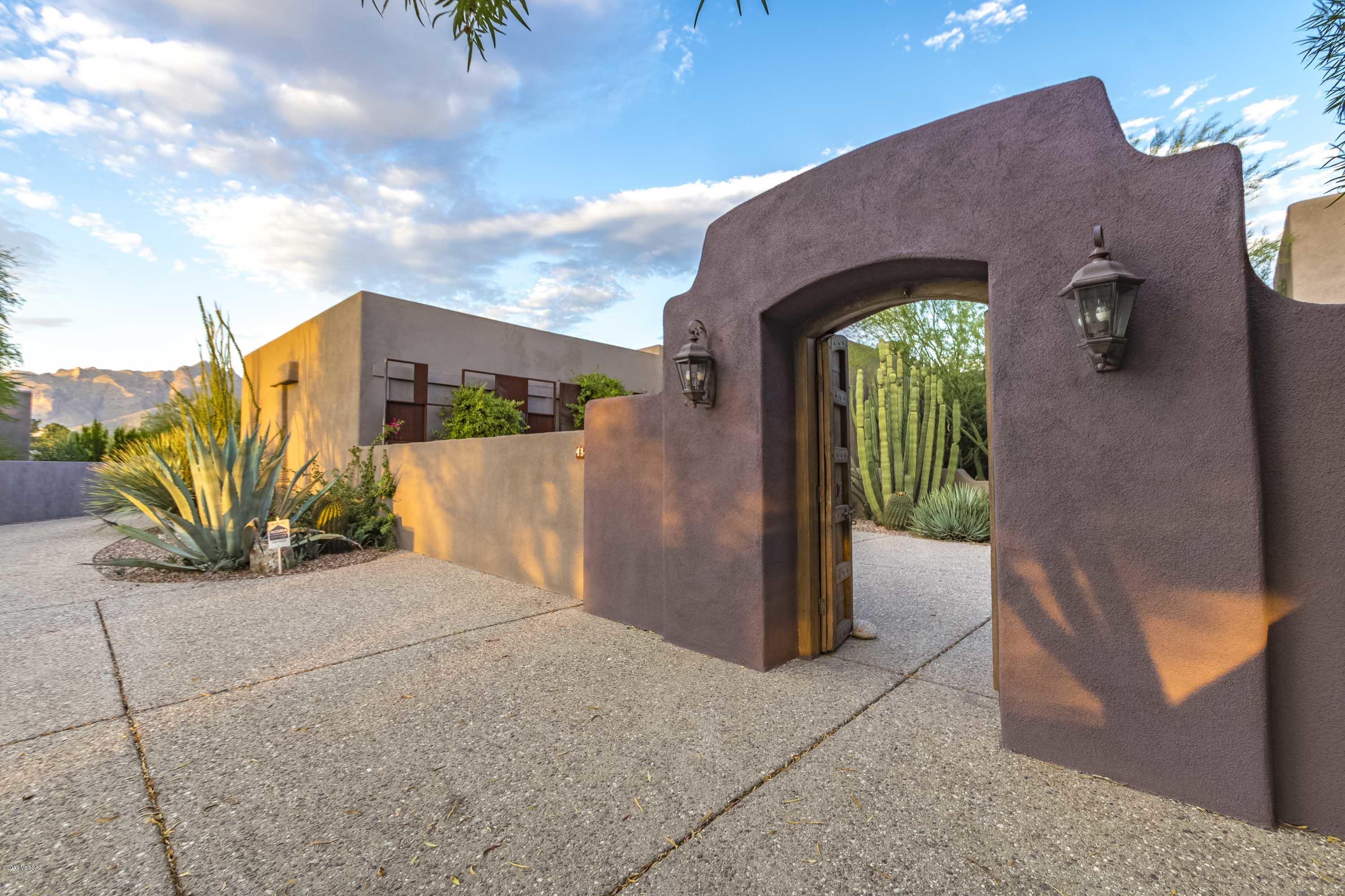 Hidden back off Camino Real this 1938 Joesler w/Tyson additions has had all the heavy lifting done on this beautiful historic home. Graceful indoor/outdoor transitions from the entertaining courtyard w/custom gates & fireplace along w/specimen cactus to the pool patio w/covered portal & fireplace to the informal kitchen BBQ patio & Catalina Mountain backdrop. Private w/mountain/city/sunset views. Freshly painted exterior, newly refinished pool, custom decorator  interior paints. Newer  copper plumbing & AC units, newer water heater, new roof. Joesler detailing, original hand painted tile accents.  spacious mastersuite with walk in shower.Additional feature is the basement perfect for turning into a wine cellar.
