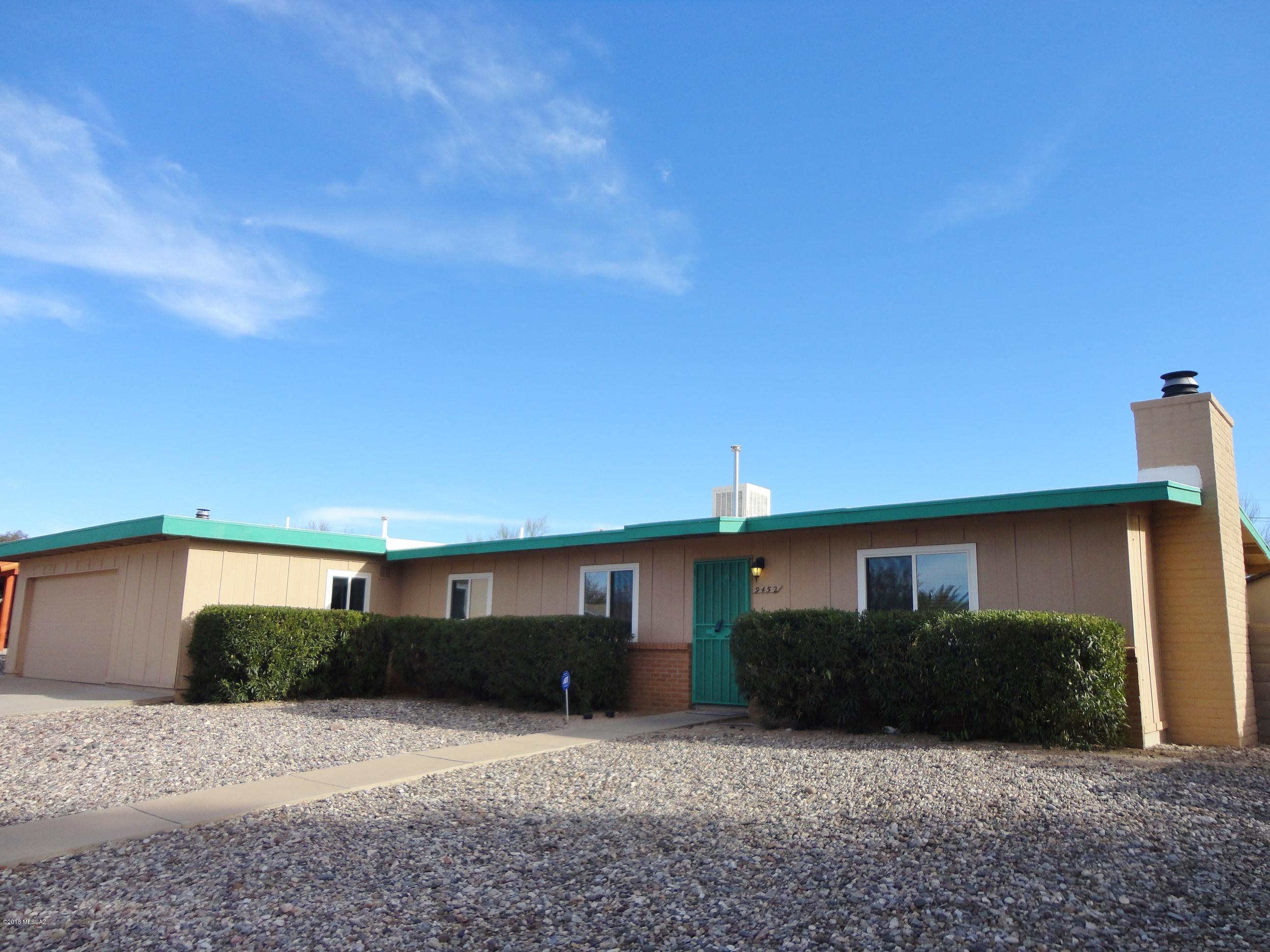 Well maintained 3br/2ba home in peaceful east side subdivision. Recent dual pane low-E windows, ceramic tile thru-out. Carpeted guestrooms. Upgraded 3/4 Master BA w/tiled walk-in shower, exec ht vanity and decorative lighting, ceiling fans in most rooms, enclosed AZroom w/dual pane slider access. Wood blinds thru-out, screened front entrance security door, 50gal gas wtr heater, wood burning FP in Living RM, special lighting in eat in kitchen, lrg laundry room, covered rear patio, lrg front/rear yrd, rear yrd access for parking RV, located on The Loop bicycle trail & newly accomplished roof re-coating w/5yr warranty. Lrg 2-car garage w/work shop area and extra storage rm. Storage shed in side yrd conveys. Newly installed EvapCooler w/new duct work, replaced/repainted facia & siding trim.