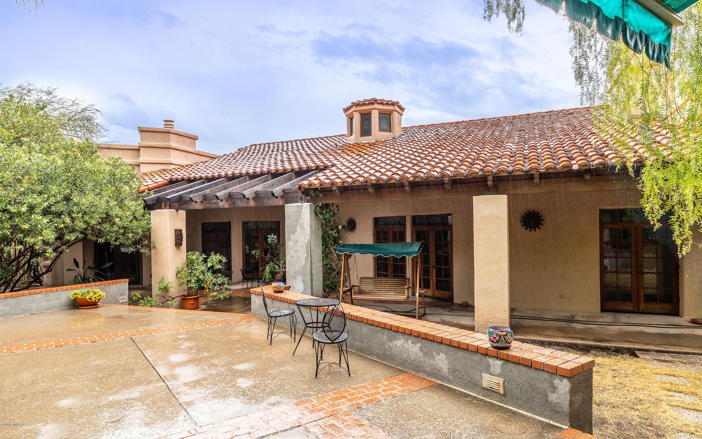 Incredible opportunity to become part of the premier gate-guarded Finisterra community. Soaring wood-beamed ceilings. Resort-like, tiered backyard with swim-up bar, spa and outdoor BBQ/kitchen. With some simple and elegant updates, this home will be a gem to own for years to come. Corner lot on cul-de-sac street. North-facing backyard. Catalina Foothills School District 16, top-rated and highly desired. Great home for entertaining. Port-cochere entrance. Kitchen currently houses 2 Subzero refrigerators, 2 dishwashers, 2 sinks and a copper-top kitchen island. Master suite has large sitting area, vanity plus 2 sinks, fireplace and jetted tub. Den/study with fireplace. Wet bar. Large clubhouse, pool, sauna, tennis. Property to be sold as-is. Buyer to verify all facts+figs, incl those in MLS.