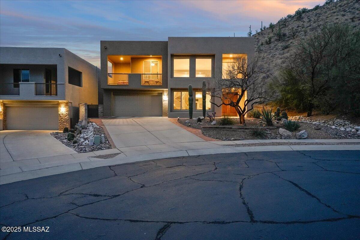 This stunning 4-bedroom, 3-bath home is nestled in the highly sought-after Foothills area. Situated at the end of a quiet cul-de-sac, enter through the gates and pass the community pool to discover this beautifully updated and meticulously maintained property. The home boasts elegant touches throughout, from the new flooring to the cascading windows and shutters, all showcasing breathtaking mountain and canyon views. Enjoy both sunrise and sunset vistas from your own private retreat.
The main level features a guest bedroom and bath, perfect for visitors. The spacious gourmet kitchen, adjacent to the breakfast nook and family room, is ideal for entertaining. Upstairs, you'll find the expansive primary suite, complete with a private balcony overlooking the pool and offering sweeping views Two additional guest bedrooms are located on the second floor, with one offering an en-suite Jack-and-Jill bath, and the other featuring its own private balcony.