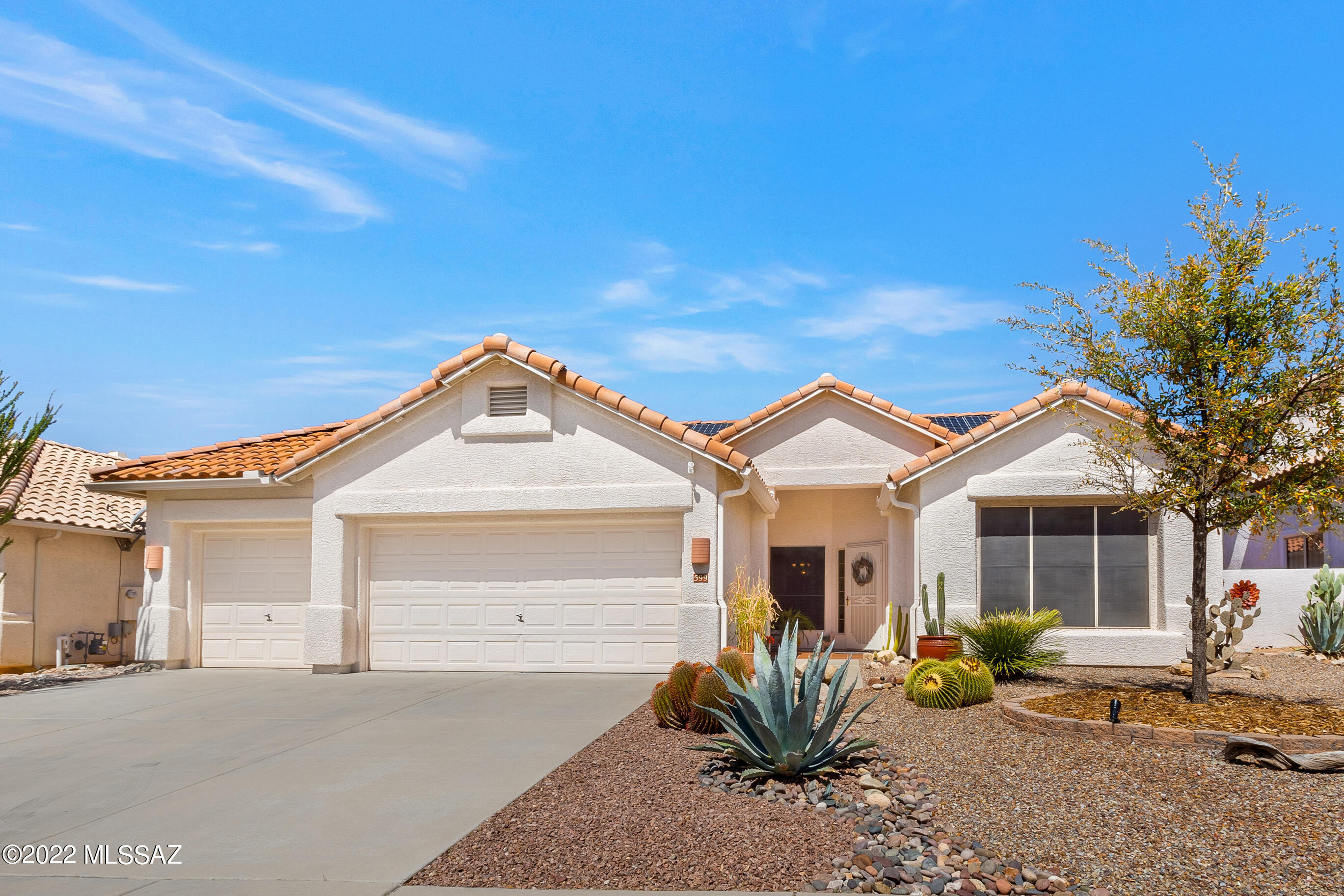 A RARE FIND! This wonderfully updated home is situated on a North-facing lot for year-round shade. The resort-like back yard has a sparkling pool, stacked stone spa and travertine decking. The professionally landscaped yard has tropical plants, fruit trees, landscape lighting, a louvered pergola, and custom cactus & palm tree metal sculptures. The open floor plan has neutral colors, two-tone paint, vaulted ceilings, sky lights, and a variety of architectural ledges, nooks and niches.  The modern kitchen has an abundance of cabinets, counter space, and upgraded appliances and you'll LOVE the renovated bathrooms and glass block shower in the Master. The owners invested in solar screens, plantation shutters, ship plank ceramic tile and OWNED SOLAR to keep you cool for next to nothing! HURRY!