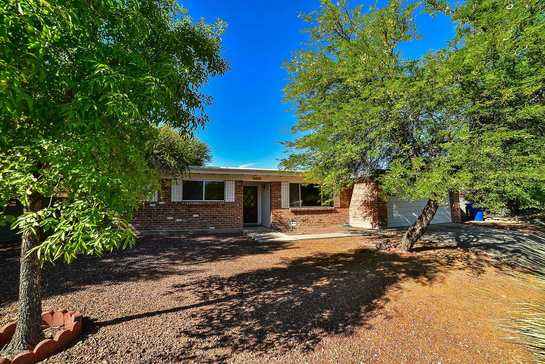 Location! Location! Location! Classic double masonry brick home in move-in condition on an amazing 13,000 sf cul-de-sac lot in pride of ownership Eastern Hills! This beautiful home has been well cared for and has a great floor plan with large rooms and an open kitchen. Features include 5 ceiling fans & a floor to ceiling pantry in the spacious laundry room.  The only interior step goes to the sunken living room. 
 There is no evap, but it is plumbed for it. The backyard has a massive covered patio leading out to one of the biggest backyards in the area. Huge mesquite trees add more shade along with many other mature trees and plants. This yard is beautiful! Shed as-is. OPTIONAL Community Pool.