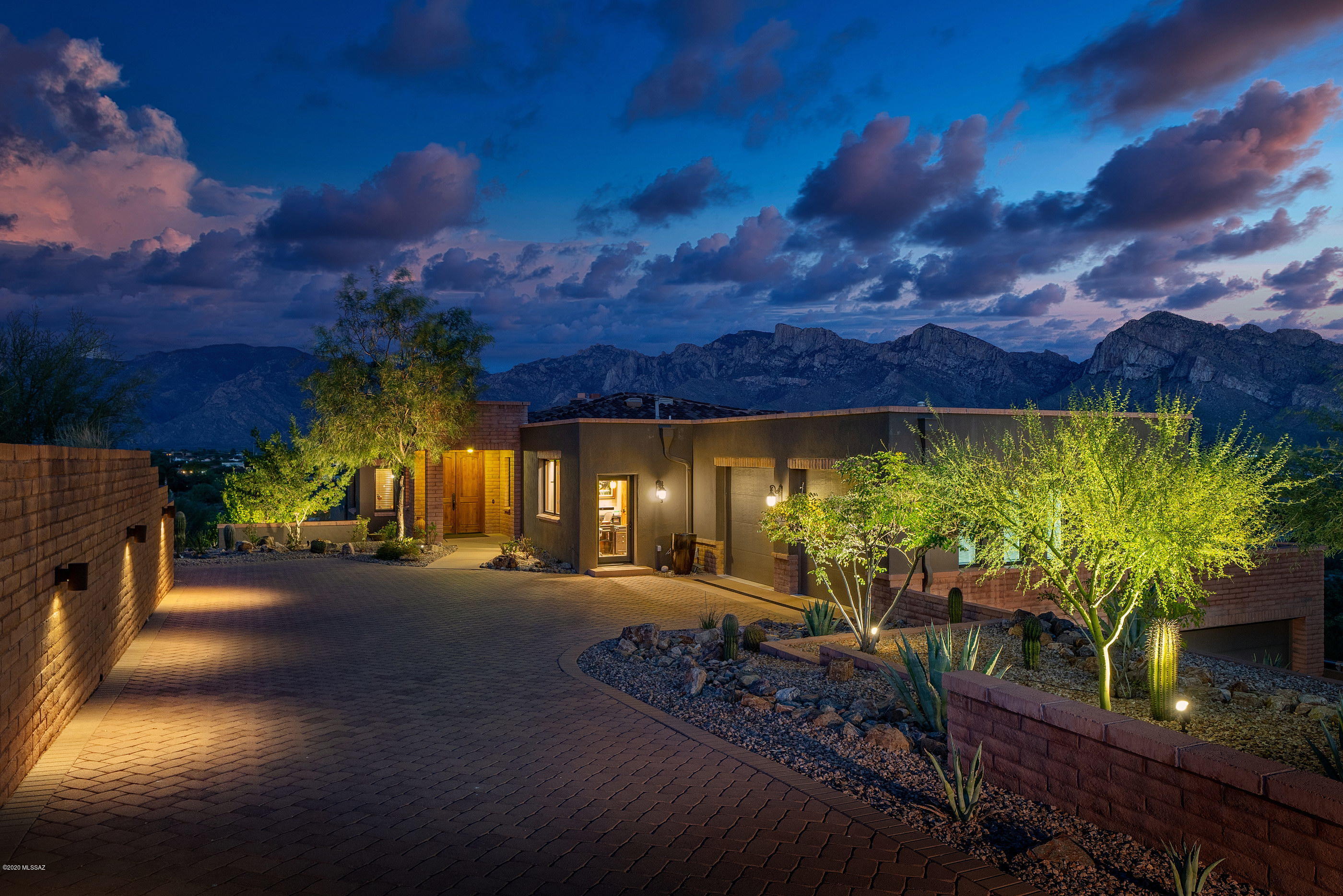 Exquisite in EVERY way! Words simply cannot do this one of a kind and truly sensational property justice— it really is that fabulous.  Situated on a hilltop lot in central Oro Valley, this custom home was meticulously engineered to offer ''in your face'' views of the Catalina Mountains and sweeping 50 mile vistas of surrounding mountain ranges, as well as gorgeous downtown city lights. The attention to detail in this property is incredible, and finished with the most impeccable of materials. Beyond the visible beauty lies truly spectacular construction- solid masonry over steel wall framing and a host of other construction upgrades. The gourmet kitchen is spectacular, outfitted with the highest end appliances and natural slab quartzite counters. More info in documents section.