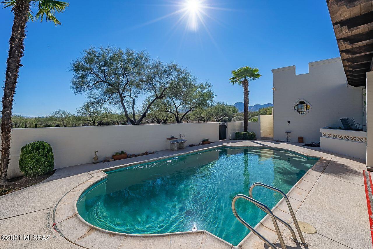 Beautiful Hacienda style home on 2 acres.  Interior extras include: 11 new skylights, 2 stoves electric and gas, 2 refrigerators, and an extra room for office or library. In 2020 Seller installed 2 new AC gas Pacs, had mold inspected, septic pumped, exterior freshly painted, roof recoated, and vents cleaned. There are 4 custom made iron security gates, huge storage area/utility room, and great 360 degrees views. Large pool in back yard. Possible guest quarters with separate patio entrance.  Must see to appreciate.