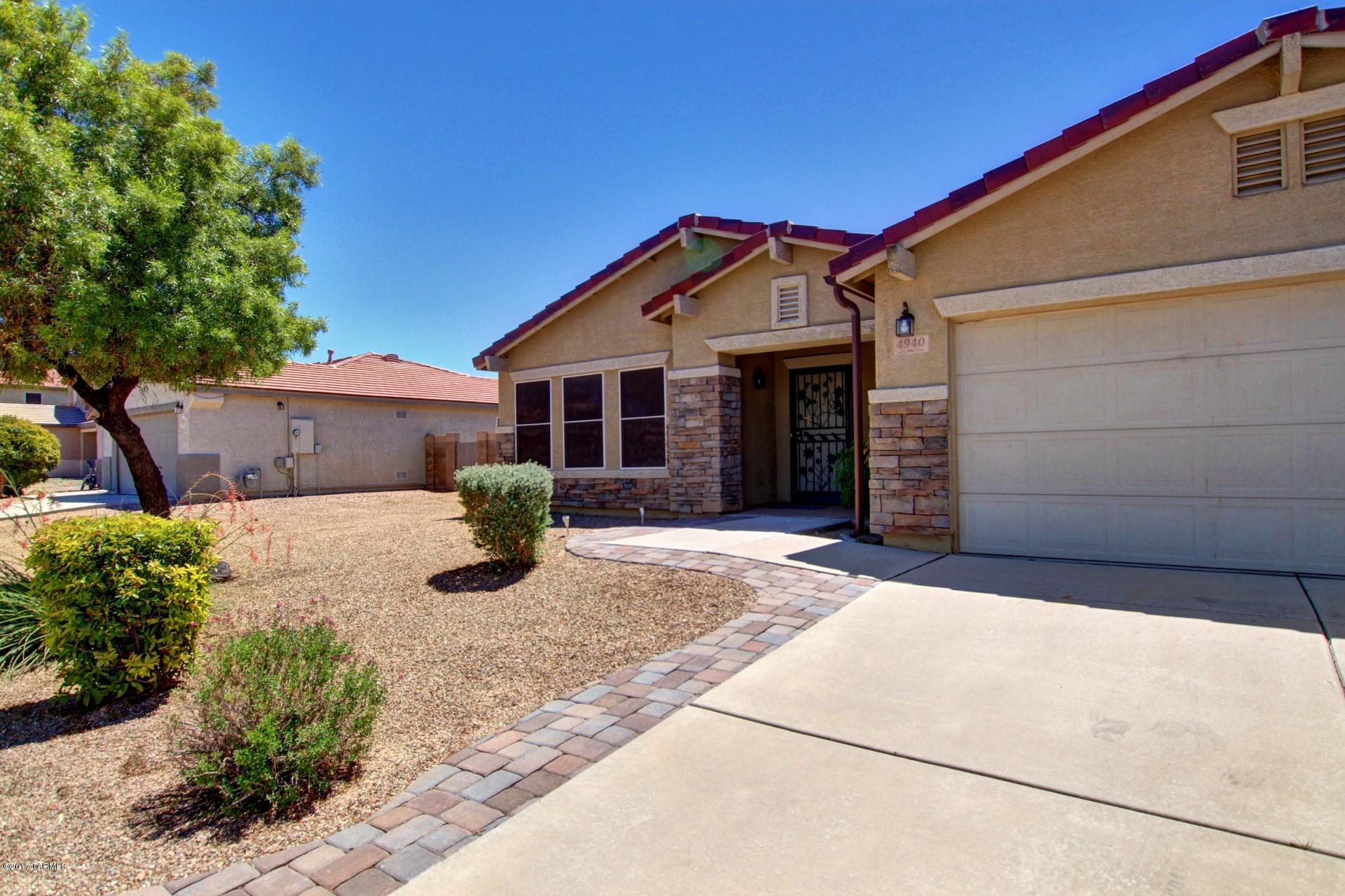 This is the ONE! Move in ready Tucson home with low care landscape and great curb appeal! Close to I-10, schools, & major shopping center. Wonderful floor plan with a formal living room, family room, and 3 spacious bedrooms. Eat in kitchen opens to the family room and boasts black appliances, Cherrywood cabinets, granite counters, and a center island with breakfast bar. Two car garage has built in cabinetry and a workbench. Large master suite has a walk in closet and a spa like bath with garden tub, separate shower, and dual sink vanity. Enjoy the amazing Arizona weather in the serene backyard complete with a covered patio, built in BBQ, and fire pit with ample bench seating. See it today and start packing! Features list is below... Home Interior:

* Garage Door fully insulated / both Bays R-11 & R-19

* Radiant Barrier & Tech Shield (reduces heat in attic & reduces electric bill)

* Soft Water Loop

* Raised Vanities & upgraded cabinets

* Surround Sound Indoor (outdoor patio)

* new Carpet

* upgraded light/fan fixtures

* R38 Insulation




Outdoors: 

* Flood light pre-wire & flood lights

* Shed (The Original Shed Company) plywood & shingles to match the home. Shelving inside

* Raised Back Wall for privacy

* outdoor kitchen gas/water/electric (Block)

* The back patio Pilars are Block/Stucco