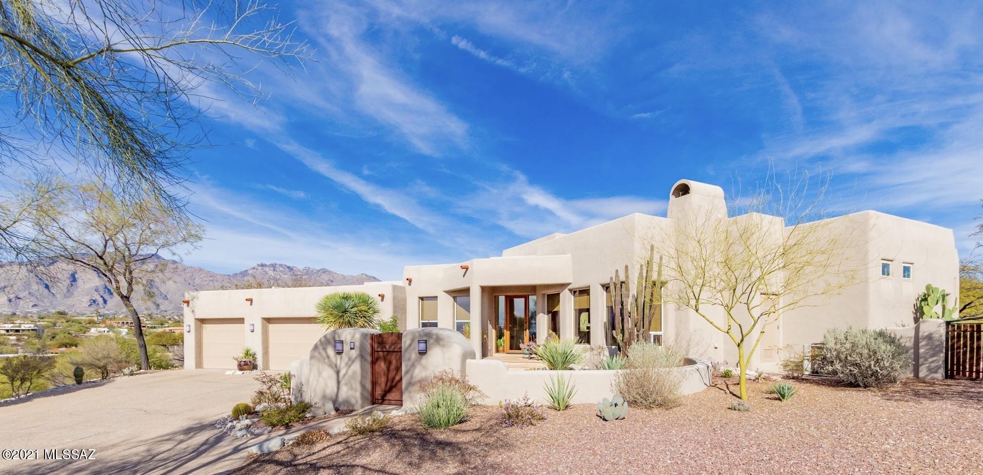 Back on the market!! Desired ridgetop location with endless Panoramic city & mountain views! This gorgeous custom home is move-in-ready with an open split floorplan. Picture windows, wood ceiling accents with Vega log beams,two fireplaces,solid wood doors, upgraded light fixtures, skylights and Travertine stone floors throughout. Enjoy your kitchen featuring custom Alder cabinetry, with granite countertops, large island with gas range and high-end stainless-steel appliances, and a walk-in pantry. The spacious master suite includes a jacuzzi tub, stylish master bedroom closet,and an additional seating area with backyard access to a private covered patio. Experience outdoor living & entertainment with covered patios, & flagstone walkways leading to a Pebble Tec pool with a waterfall feature. Gather around the firepit with family and friends!  The exposed aggregate driveway leads to an oversized, finished 3-car garage with painted floors, a separate 7x8 indoor workshop and a 15x8 storage closet. Beautifully designed low maintenance landscaping surrounds the property.  Schedule an appointment today!