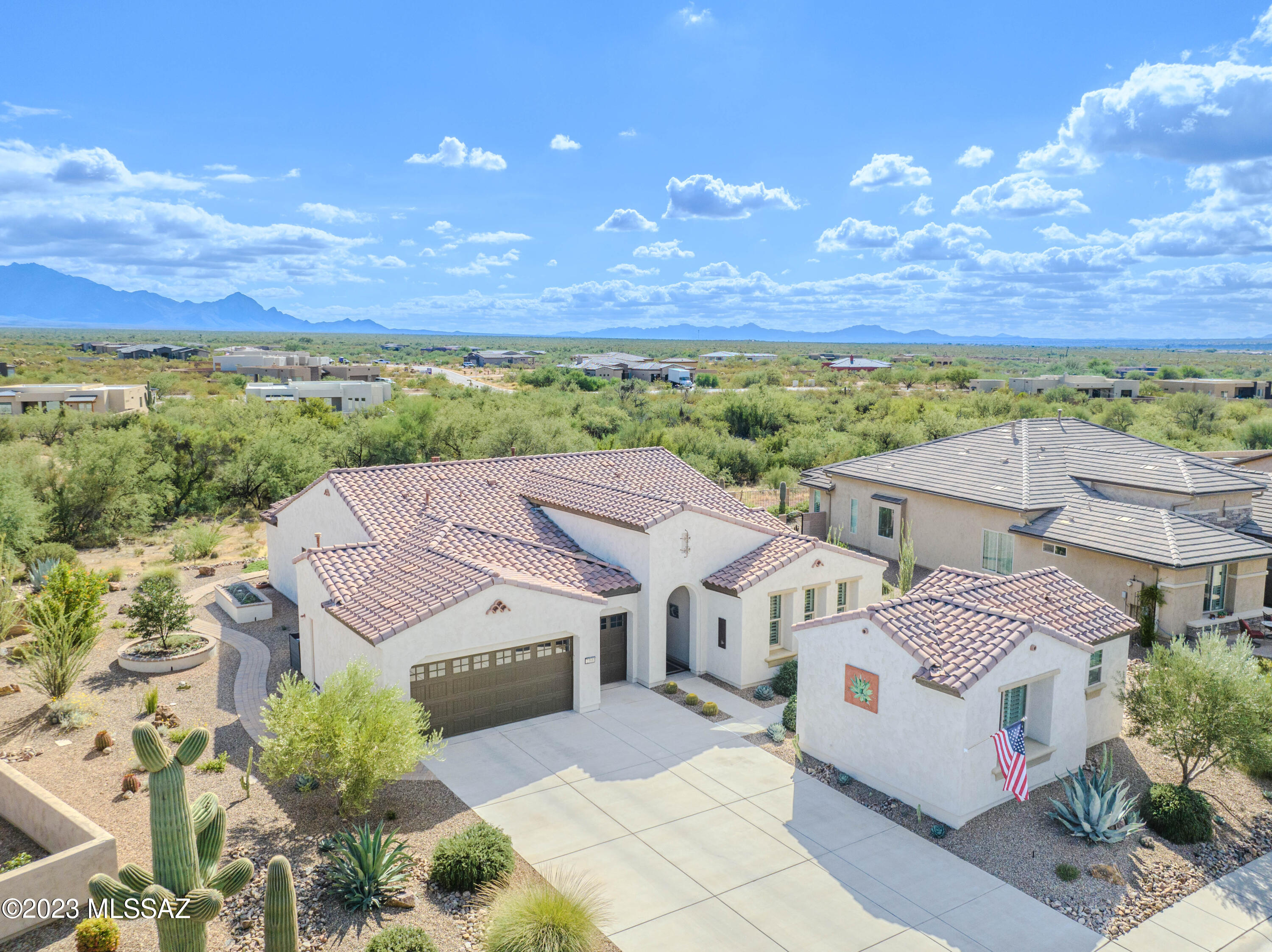 Location, Location! Nestled in the breathtaking surroundings of Santa Rita Mountains & in close proximity to the renowned Madera Canyon, this property offers an unparalleled opportunity to embrace the beauty of Southern Arizona's landscape. Step inside, & you'll be greeted by a modern oasis with gorgeous Santa Rita mountain views from the main living areas. High-end features throughout the home include tile flooring, quartz countertops, custom lighting, custom ceiling fans, & beautifully crafted cabinets, creating an atmosphere of luxury & sophistication. The open-concept design allows for a seamless flow between the spaces. The kitchen is a chef's dream, with a gas cooktop, kitchen island, and a gas fireplace in the Great room. A Butler's pantry adds an extra touch of elegance and functionality to this culinary haven. The property also boasts a large laundry room with ample storage and a utility sink, making daily tasks a breeze. The primary suite is truly fabulous, and the split bedroom floor plan offers privacy and comfort for both homeowners and guests. Take a stroll along the paver sidewalk that graces the north side of the house, allowing for a leisurely and scenic exploration of the property. The 2.5 golf cart garage is epoxy-coated and includes hot water recirculation and a soft water system, ensuring convenience and comfort. With an open back yard that extends to a desert arroyo, you'll have the perfect vantage point to observe the diverse wildlife in the area. The property also features a guest house casita, providing an ideal retreat for guests or extended family. Reap the benefits of generating your electricity from sunlight. With the solar owned system, you can significantly reduce your electricity bills. This property is more than just a home; it's a lifestyle. Enjoy the tranquility of the desert landscape, the convenience of high-end features, and the warmth of a welcoming community. Don't miss the chance to make this extraordinary property your own.