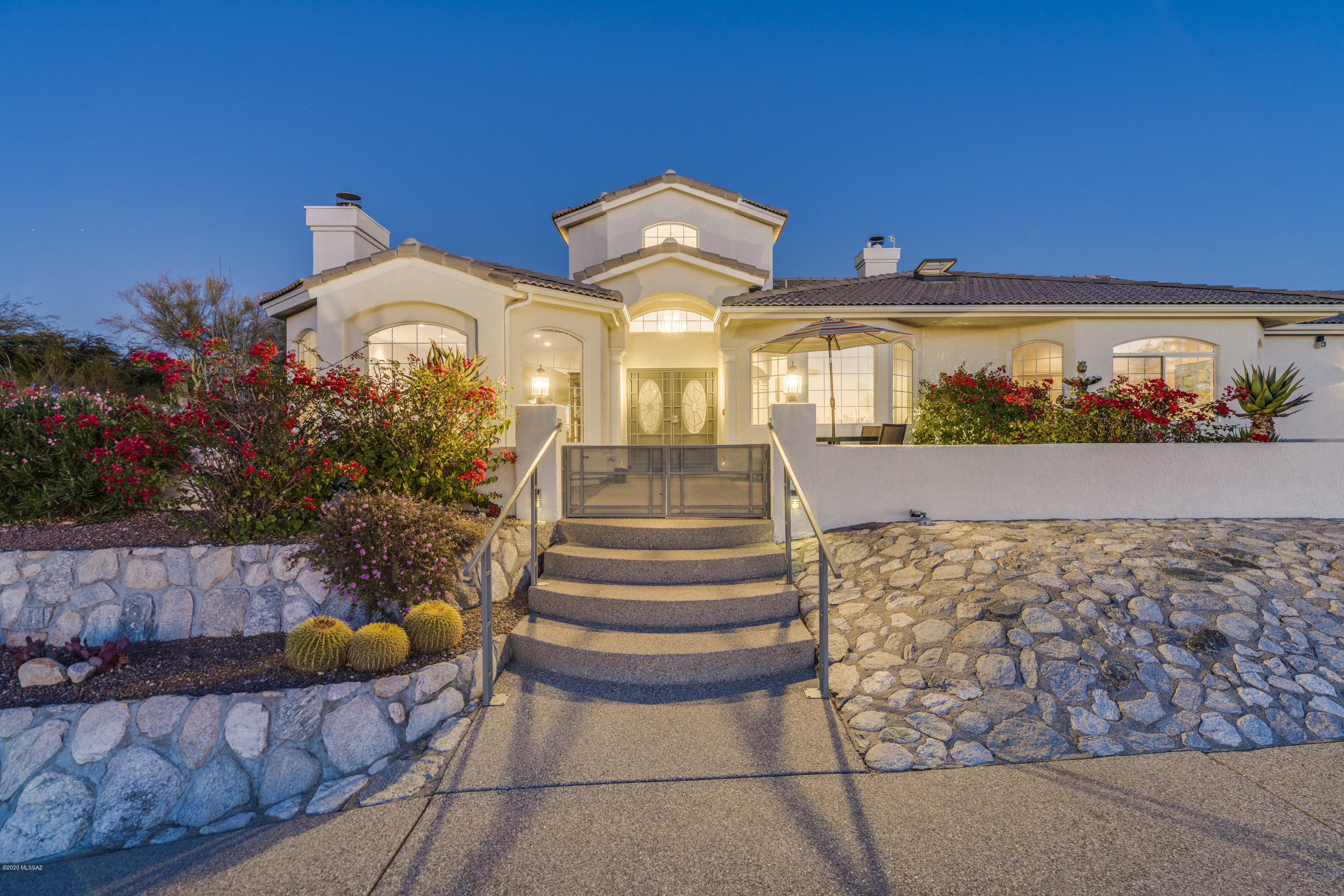 Magnificent custom-built home strategically perched on a premium lot to savor the spectacular city & mountain views. High on the ridge & on a cul-de-sac for stunning privacy. Enjoy abundant natural light & desert beauty from every window. Dramatic foyer welcomes w/ soaring ceilings, cozy family room & stone fireplace. Casually elegant floor plan w/ formal living & dining room ideal for entertaining. Well-appointed kitchen w/ ample cabinets/counter space & inviting breakfast nook. Home is meticulously maintained w/ engineered hardwood flooring, freshly painted interior, high quality designer finishes throughout, speaker system & recessed lights. Fabulous outdoor living space w/ extended covered patio, new Hot Tub, built-in BBQ & water features. Your own private oasis is ready for you!