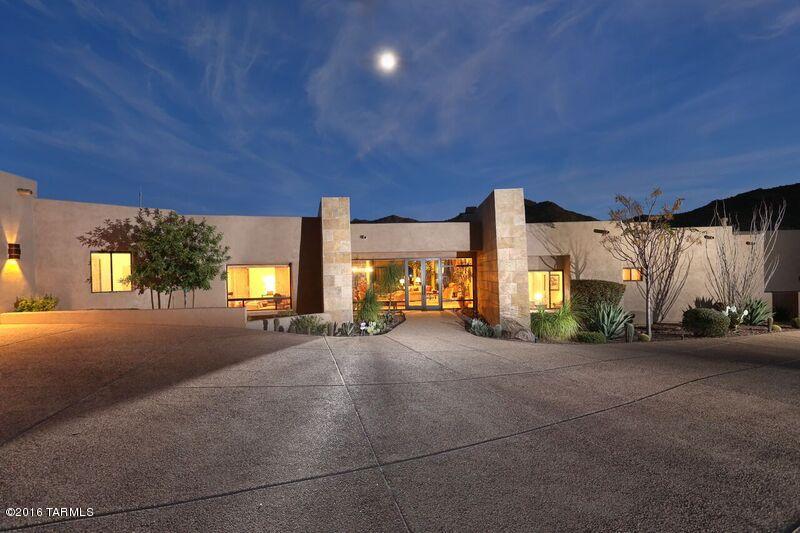 Custom contemporary masterpiece w/versatile interior! Spacious 4 car garage w/storage, from there enter the easy flow floorplan - Spacious Master suite leads out to the separate den/bedroom w/private bath & closet. The grand great room is bright, beautiful with art work friendly alcoves & wall space! Lovely dining area with bar into the greatest cooks kitchen ever with separate island & wall of appliances. Don't want to eat at the bar? - there's a cheery nook w/open access to the patio/pool. The media Room is situated w/convenience for all-guests, family, friends-& has it's own bar, cabinets & storage, access to private powder room in hall. 5 covered porch areas, a pool, spa, barbecue & outdoor powder/pool bathroom. The setting is peaceful & charming & elegant. Home is an exquisite estate.