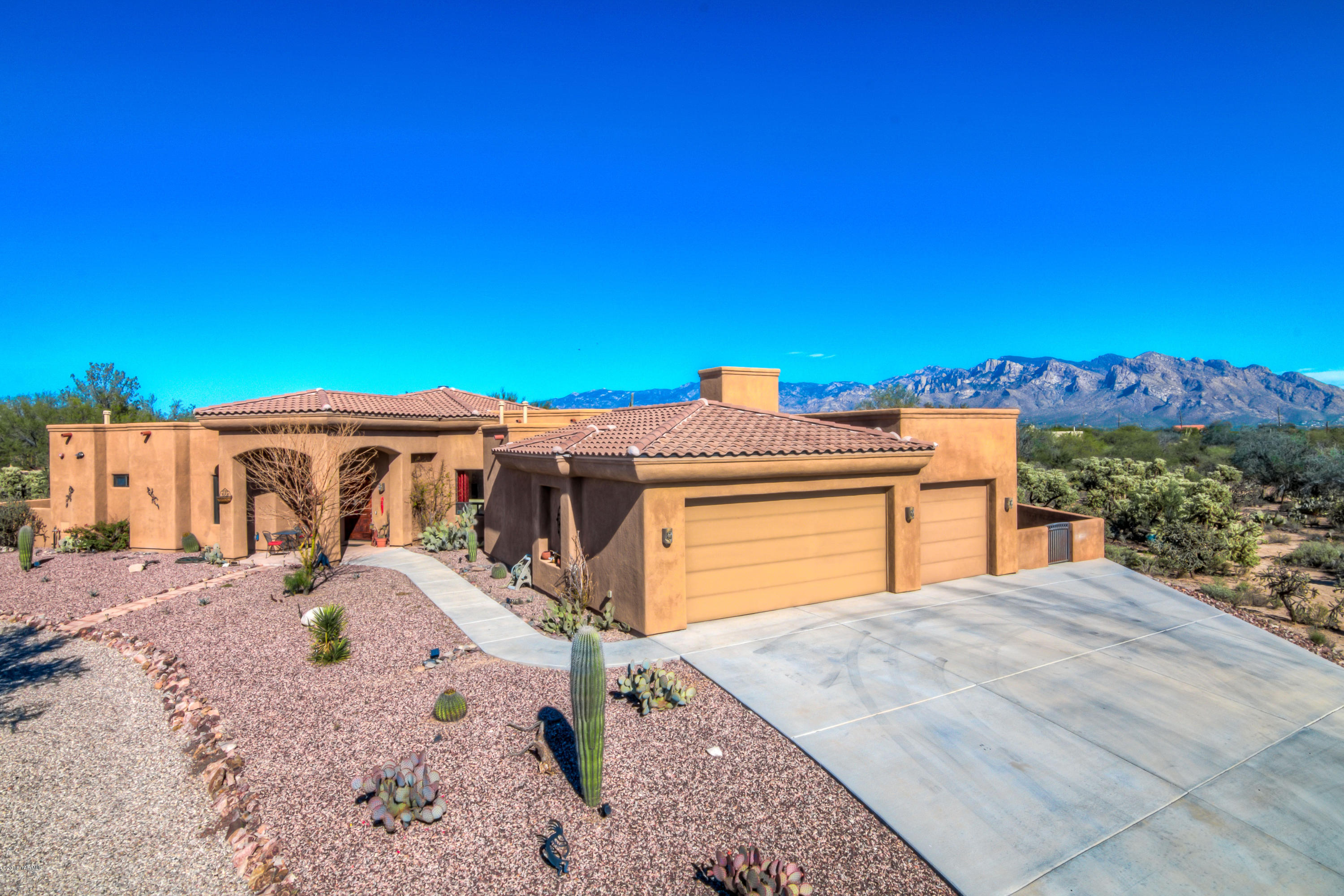 Amazing Northwest Home! Upgrades galore!  Large picturesque dual pane windows throughout! Colored poured concrete! Tons of Skylights! Lots of Custom Designer touches throughout! Stunning Kitchen has lots of gorgeous cabinets and granite counter tops, stainless steel appliances, designer lighting and much more! Huge Master Bedroom has a fireplace in the sitting area and windows facing the mountain views.  Master Bath has a HUGE walk-in closet, dual sinks, separate shower and soaking tub.  The Backyard Oasis has amazing mountain views, large covered patio, pool with swim up bar to the outdoor kitchen.   A great place to entertain- there's a TV, grill, refrigerator and much more. Extended 3 car garage!  Observation deck over garage to watch the spectacular sunsets! This is a must see!