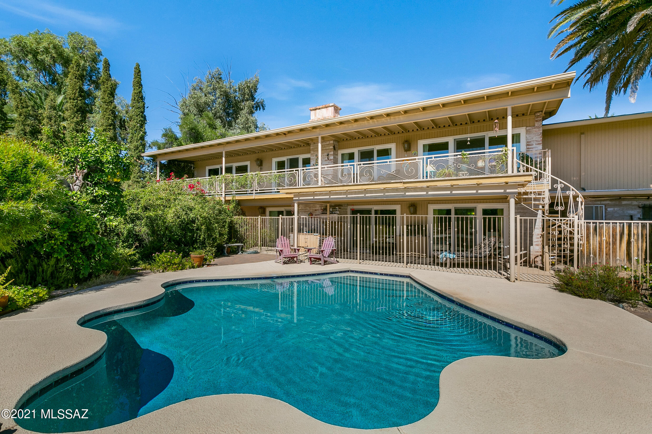 Mid-Century, 2 story gem in the Catalina Foothills.  4bdrm 4bth home with guest home.  4124 sq ft home on 1.12acres.  Astounding views from upper story windows. Gorgeous City and mtn views. 180 degree views from the deck.  Large mstr bdrm with gorgeous wrap around views of the Catalinas, Rincons & Maderas.  2nd possible mstr downstairs. Guest house with full kitchenette.  Guest home is being used as art studio. New roof in 2015 and new water heater in 2019.  Dual pane energy star windows /doors. Beautiful fireplaces in family room and great room.  Gorgeous ceilings in formal dining room.  Beautiful kitchen with butcher block island.  61ft full length deck with spiral staircase leading to backyard. Pebble tech pool and new equipment in 2018.   See Documents for more This home has too much to list including a detached garage with storage or workshop.  Will not last with those incredible views.  Sellers are down sizing so bring all potential offers and make this beauty yours.