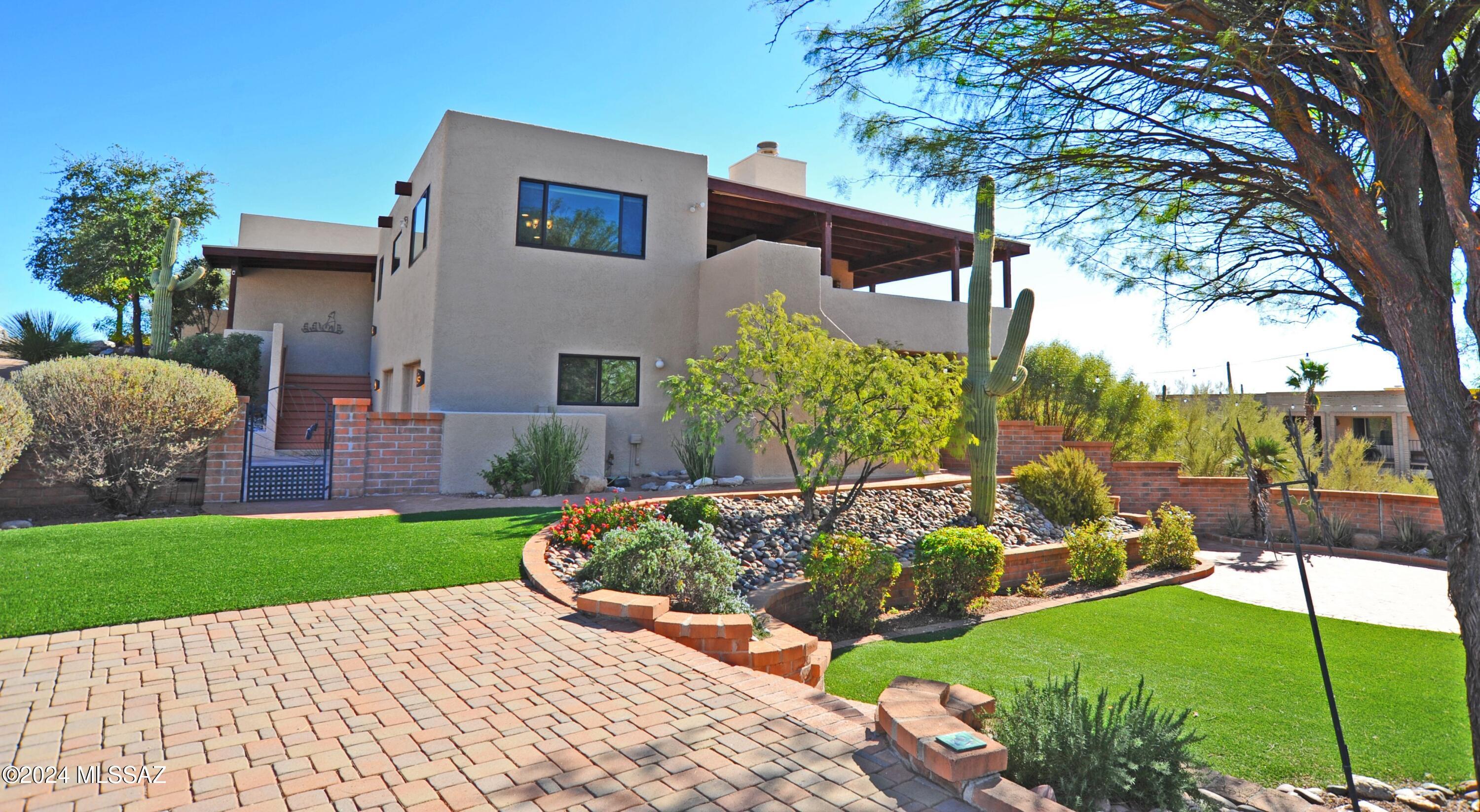 Experience breathtaking city and mountain views from this stunning 5-bedroom home in the Catalina Foothills! Situated in a prime location that offers both privacy and convenience, this property is nestled within one of the area's most sought-after neighborhoods. The newly upgraded kitchen features sleek quartz countertops, a large center island, and stainless-steel appliances. All three bathrooms were recently renovated. Newer AC units on both sides of the house. The home boasts multiple outdoor spaces that are perfect for relaxation and entertainment. Pool/spa area provides a spectacular backdrop of city lights and mountain vistas. Enjoy phenomenal view from nearly every window and meticulously maintained yards!
Additional highlights include an extensive deck providing view and shaded spaces, an oversized garage, large storage room, 24/7 roving security, brand-new remote-control window blinds, newer water heater, dishwasher, refrigerator, and much more.
Don't miss the opportunity to own this exceptional property in Cimarron Foothills Estates!