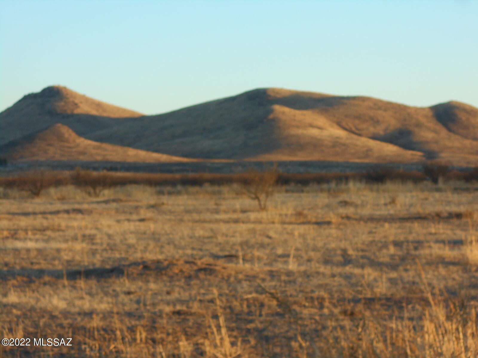 Beautiful, spacious, 20 Acre parcel with wonderful views of the Square Top Hills, the Chiricahua National Monument and the Dos Cabezas Mountain range in the distance to the North!  The owner started setting up an off-grid project and has some of the equipment that can be purchased private treaty.  There's a shed that is nearly complete and interior fencing for your pets or farm critters.  Power is a short distance from the property line, so you can bring power in or stay off-grid.  Drill a Well or haul in water.  The Privacy and Peace and Quiet of this place will be the escape you've always dreamed of.  The place is ripe for a self-sufficient homestead.  The RV, van, and solar equipment may be purchased as well.  Flexible RU-4 zoning.  Make your dreams come true!