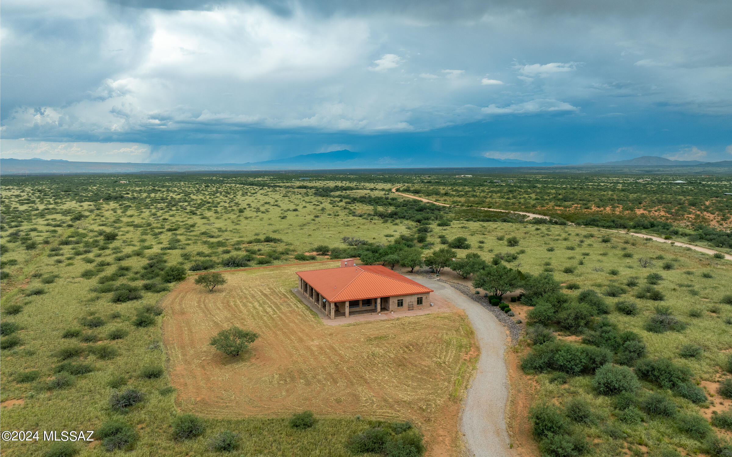 Discover a unique gem in Dragoon Mountain Ranch with this expansive ranch house spanning over 4,300 sq. ft. on 36 acres. This gated estate features 3 bedrooms, 2 bathrooms, and robust block and steel construction. Enjoy exceptional amenities, including a personal pub for entertaining and an indoor shooting range with walk-in gun safe rom for enthusiasts. The wrap-around porches offer stunning views and a perfect spot to relax. Experience the ultimate in privacy and comfort in this sought-after community. Also includes a huge 3 car garage with work shop, private well, full RV hookups.  The property is fenced with a secondary powered private gate. Easy 4th bedroom conversion.
Hidden range/safe is behind the mirror in guest wing. Owner agent.